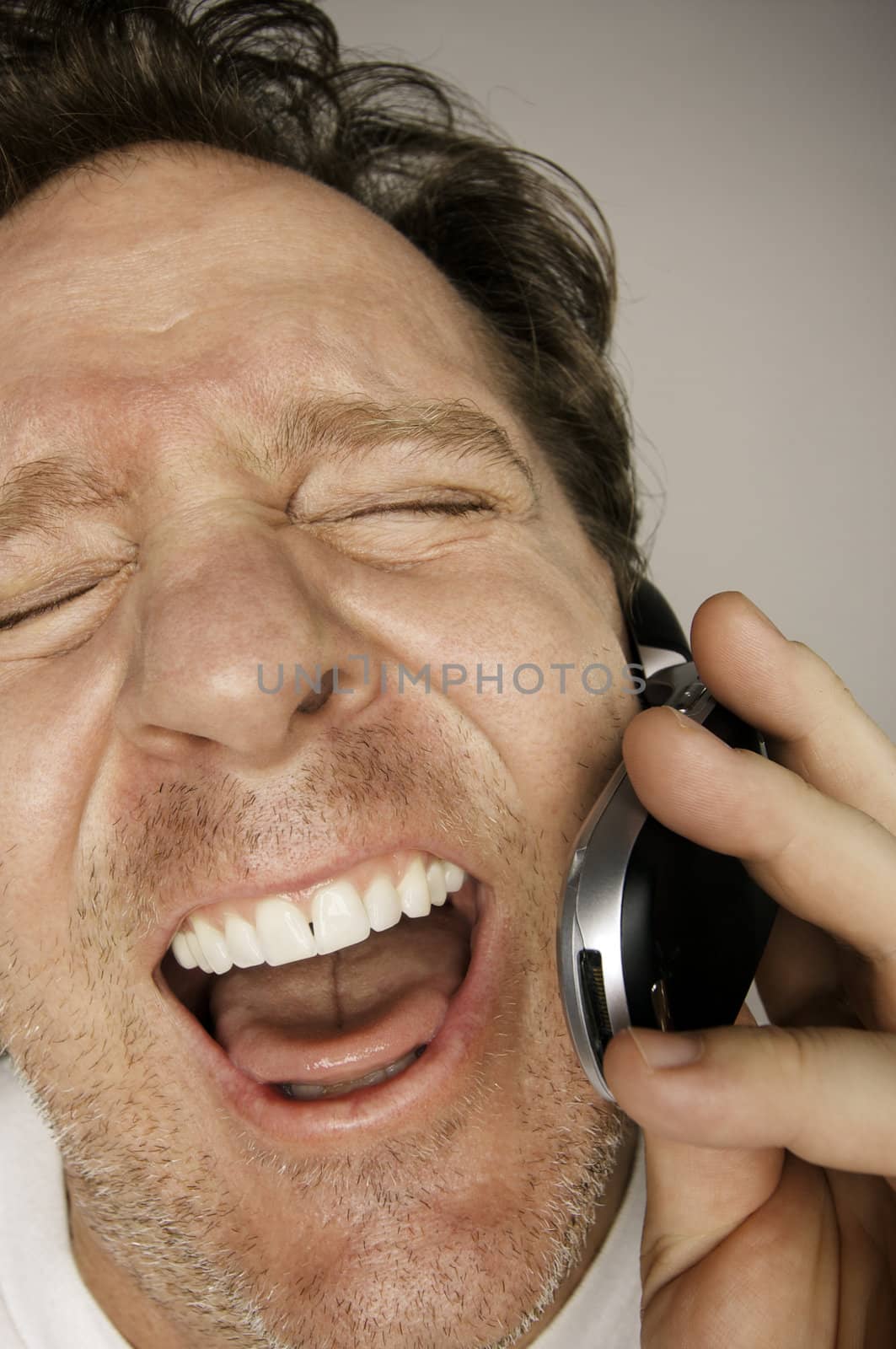 Ecstatically Happy Man on Cell Phone by Feverpitched