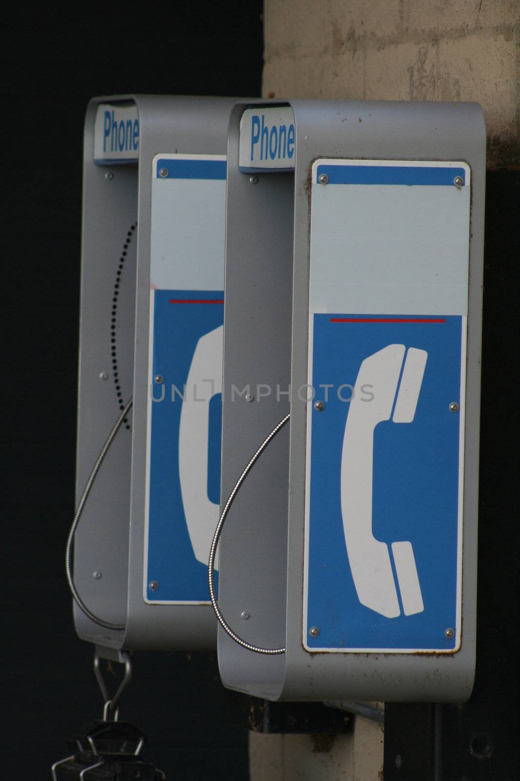 Close up of a phone booth in a park.