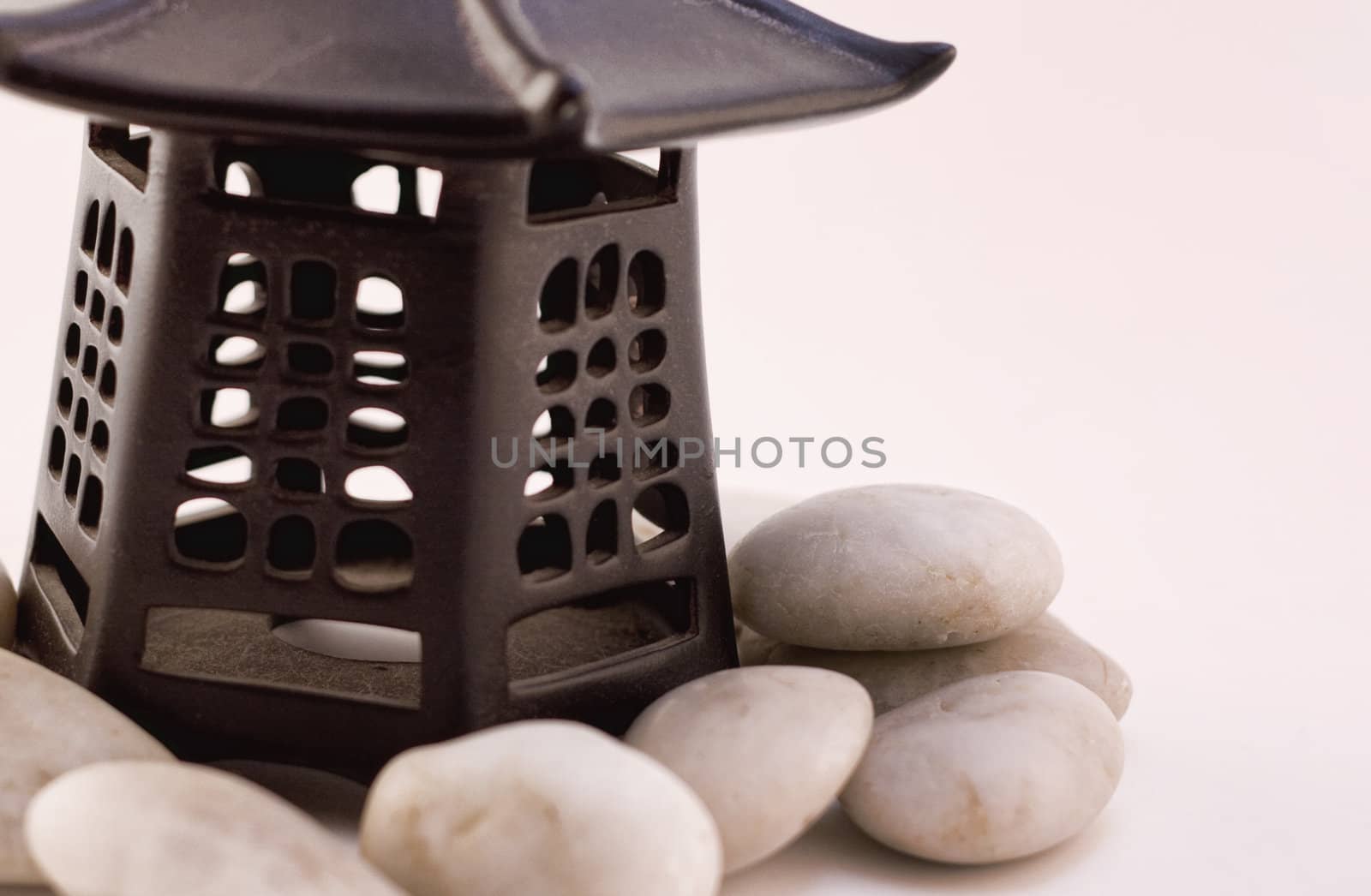 Asian style lantern with white rocks