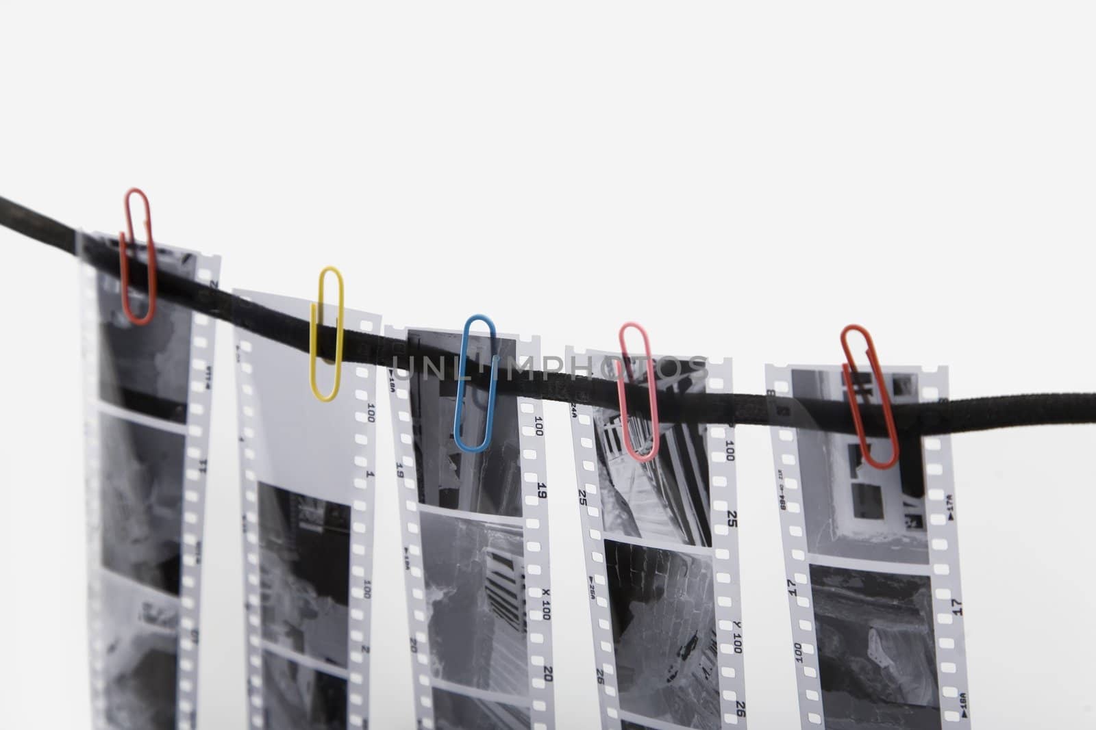 five film strip and colored paper clip