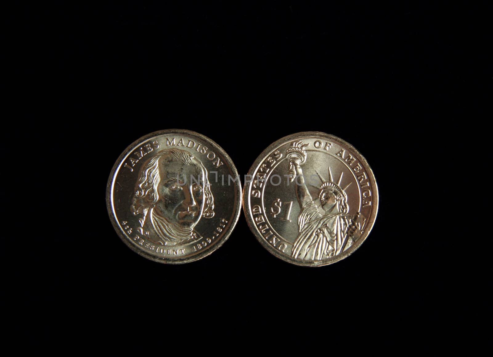 A one dollar James Madison and statue of liberty US coin