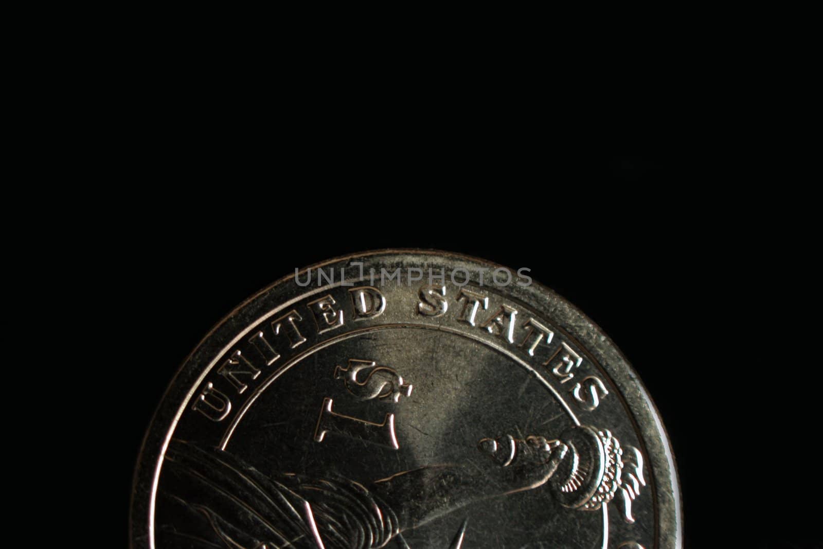 The words United States printed on a dollar coin