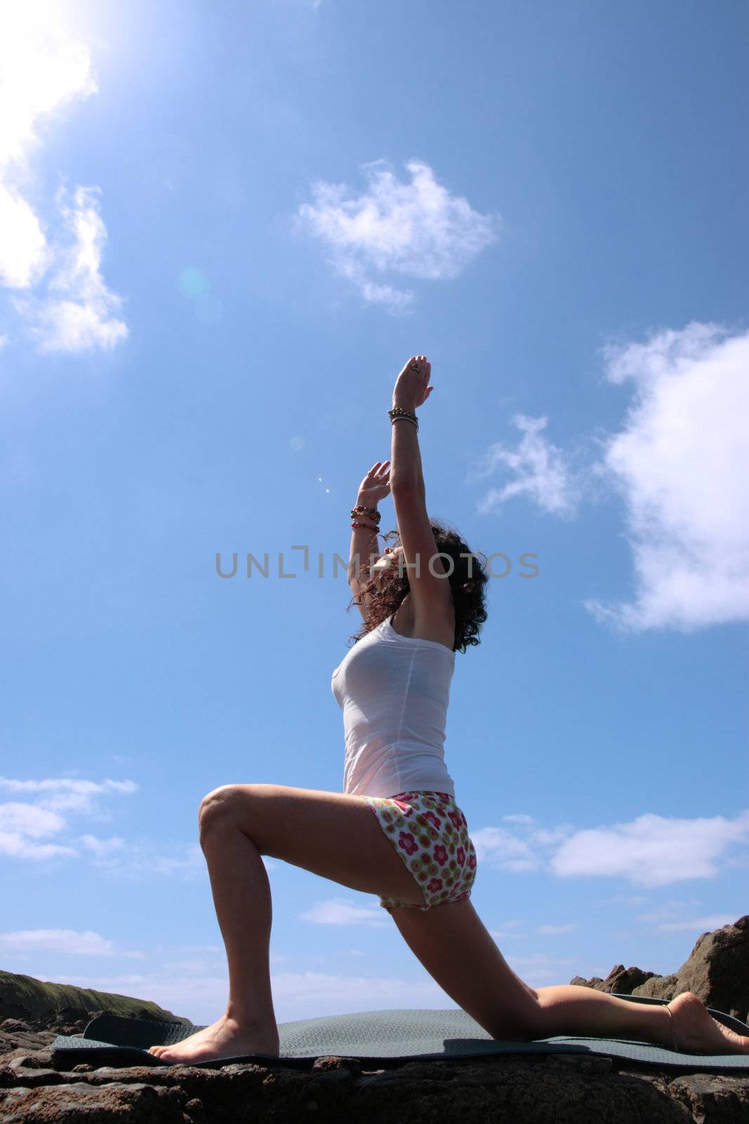 a beautiful woman doing yoga to show a healthy way to live a happy and relaxed lifestyle in a world full of stress