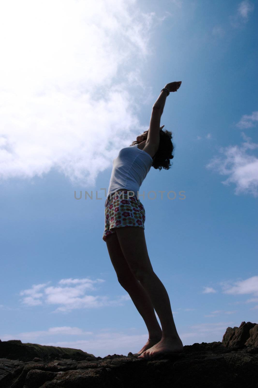 a beautiful woman doing yoga to show a healthy way to live a happy and relaxed lifestyle in a world full of stress