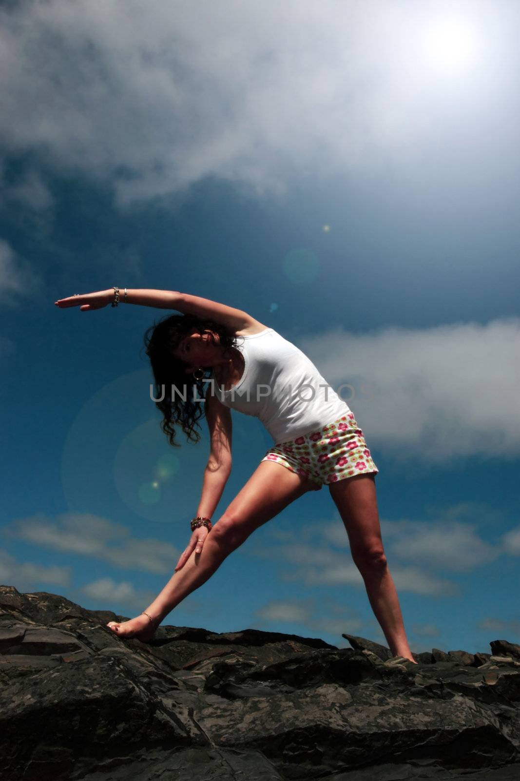 a beautiful woman doing yoga to show a healthy way to live a happy and relaxed lifestyle in a world full of stress