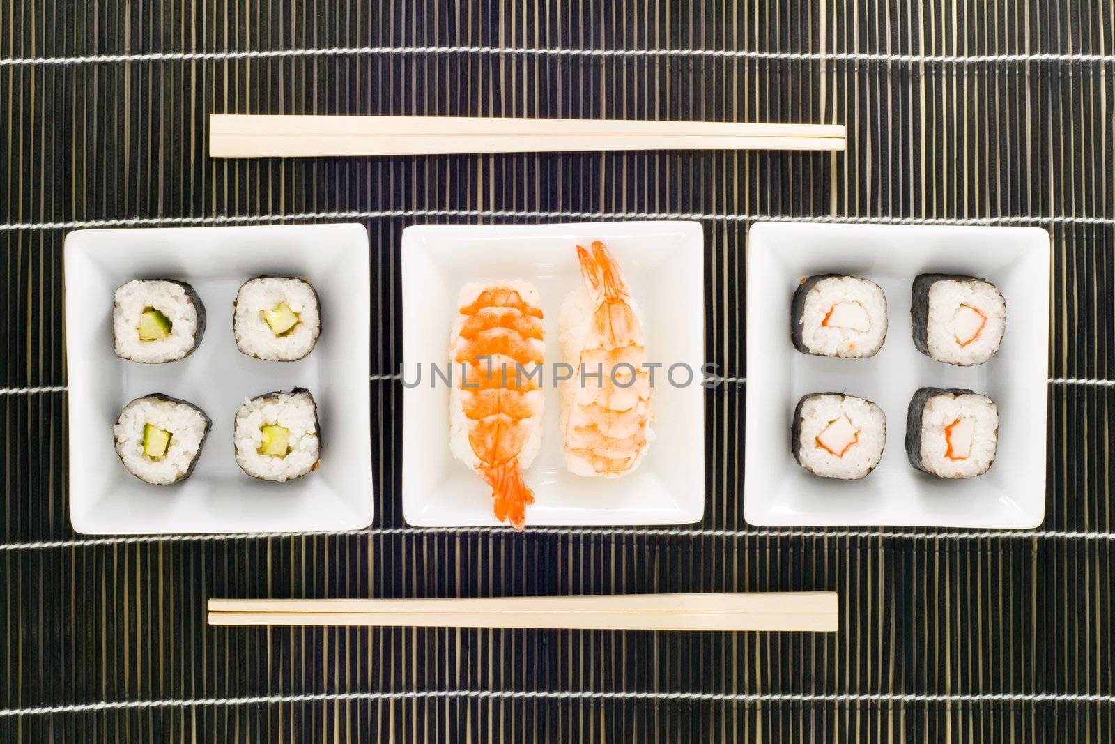 three plates with different kinds of sushi