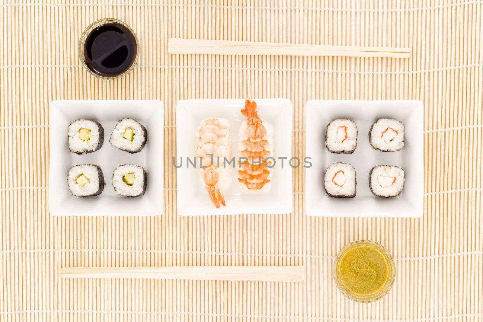 a plate with different kinds of sushi