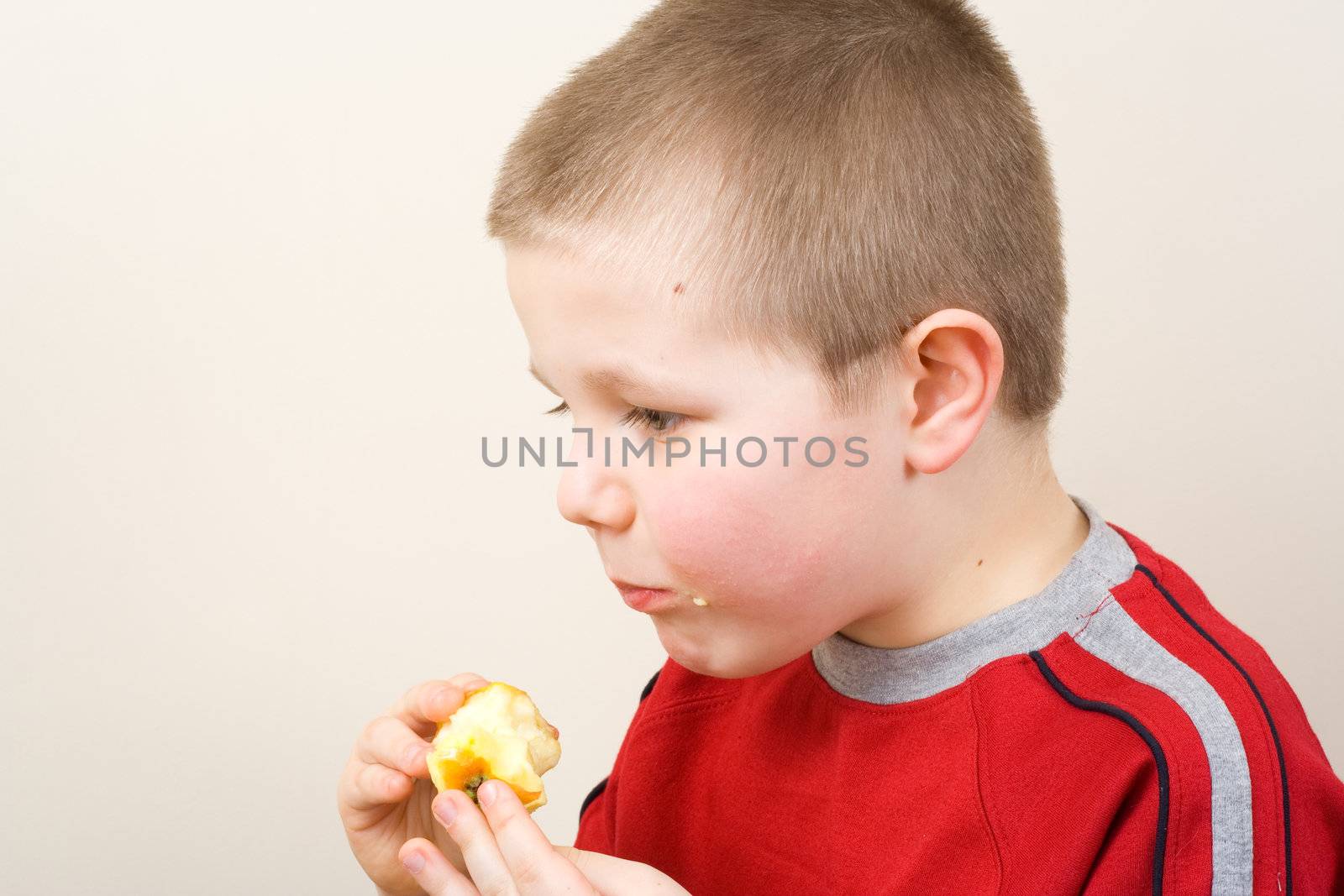 Boy eating the apple