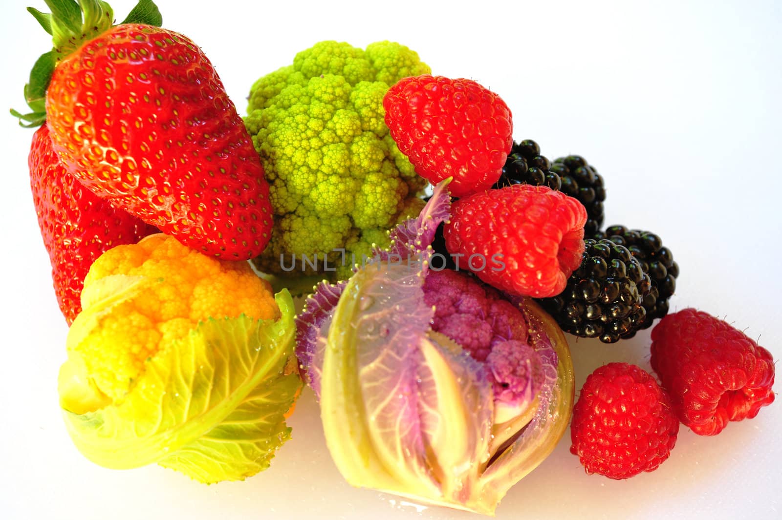 Isolated Vegetables, Blackberry, Raspberry and Strawberries on a white background.