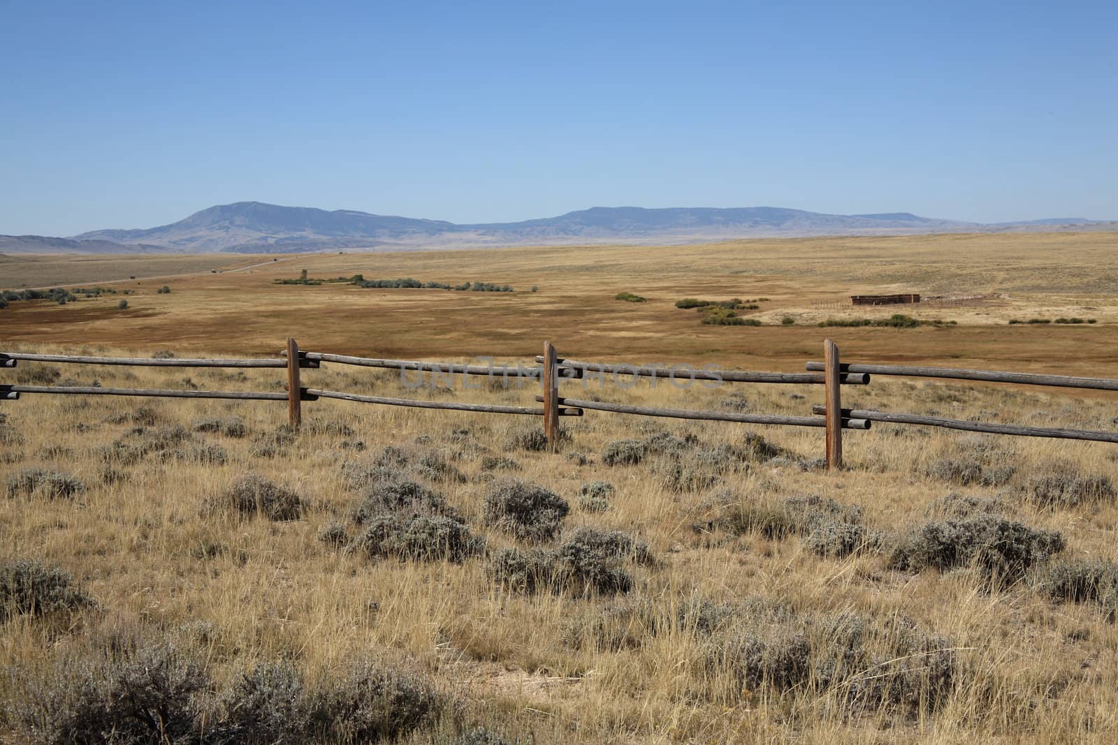A fence marks territory in Wyoming's back country.