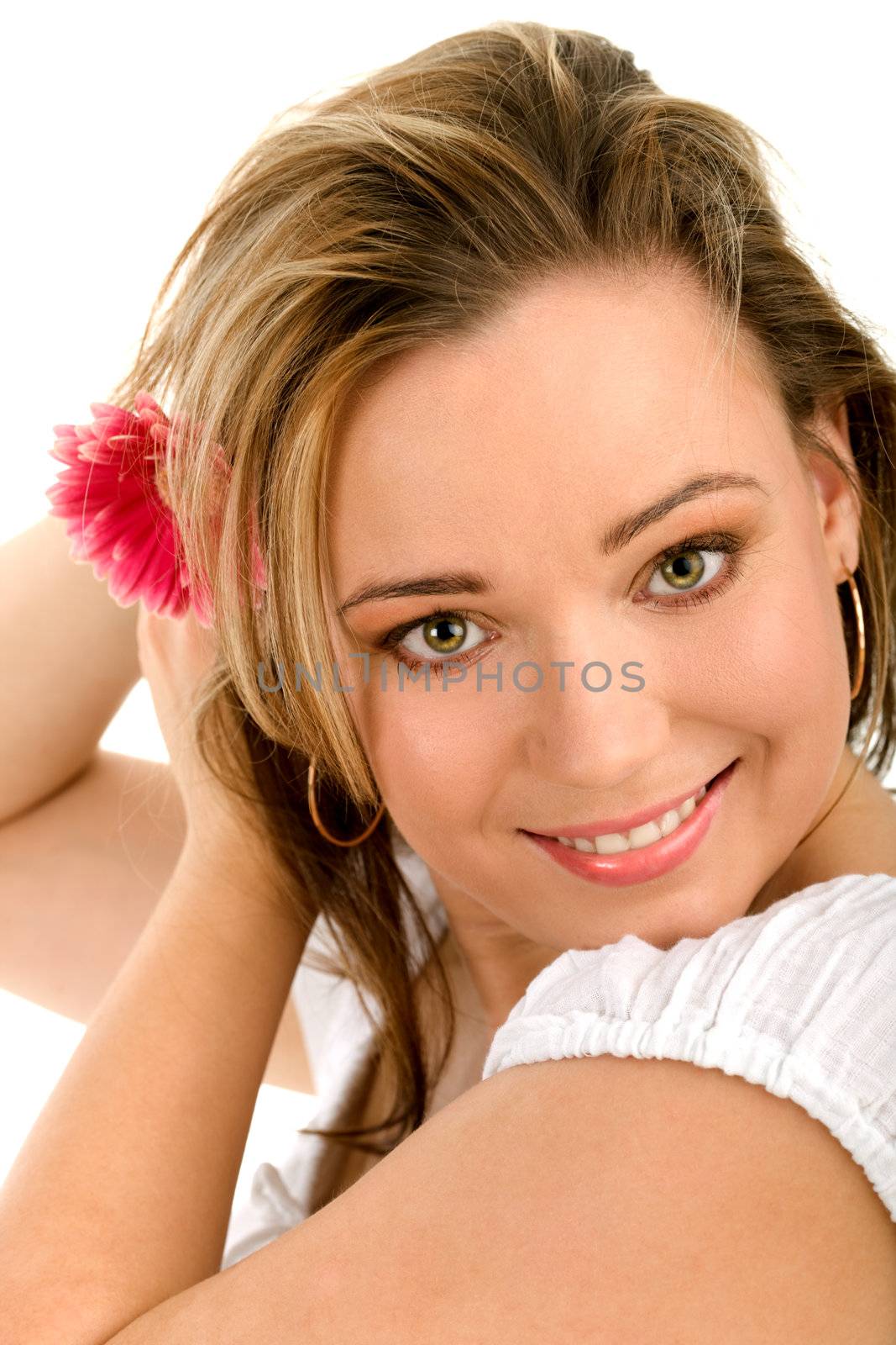 Portrait of lovely girl holding fresh pink herbera