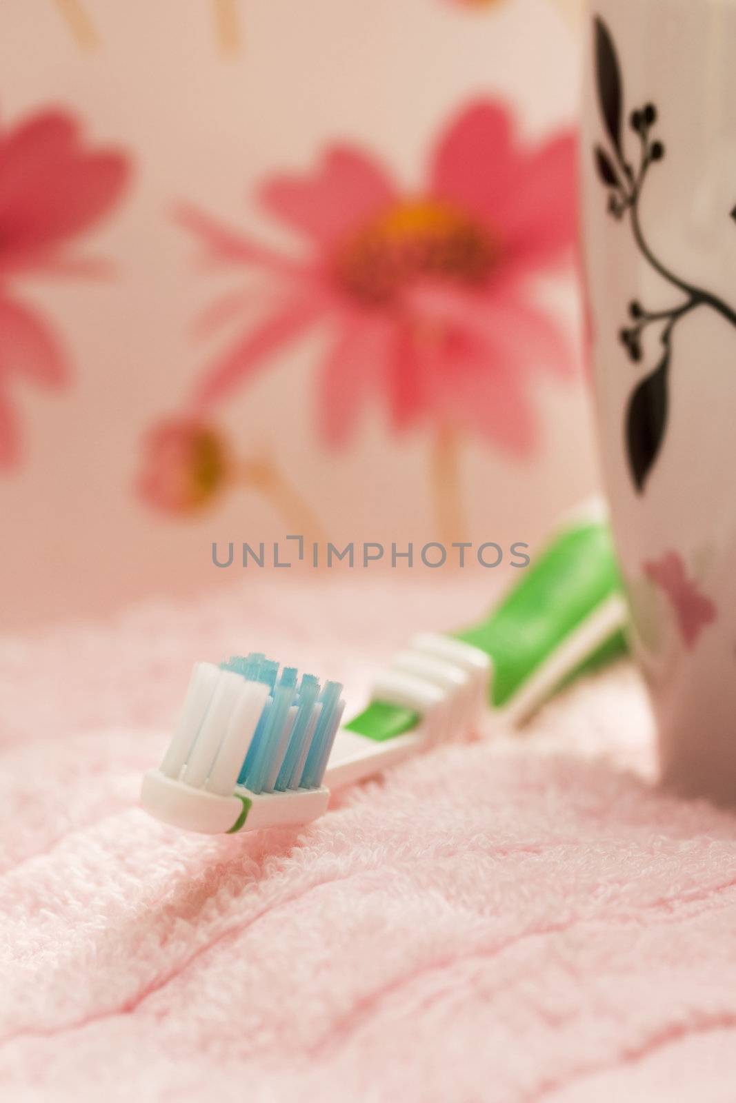 Toothbrush on the pink towel