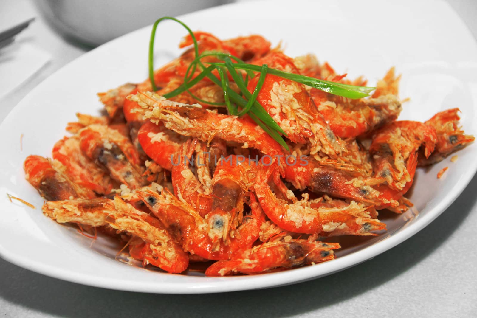 deep fried crispy shrimp served in a dish
