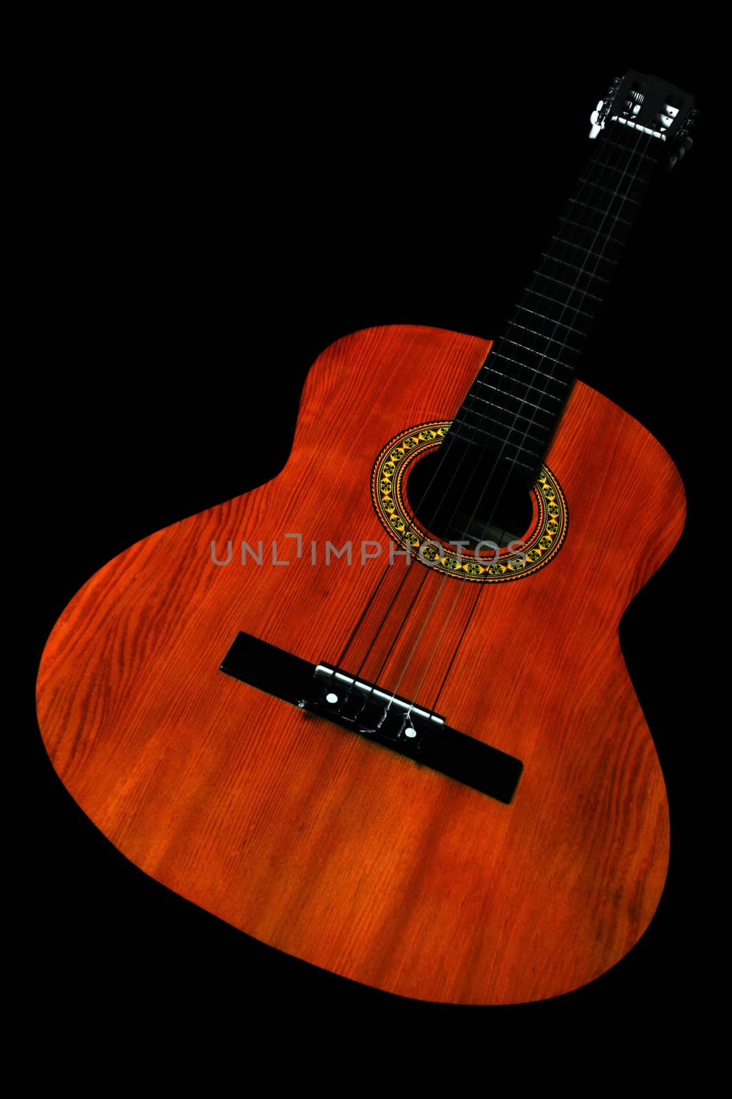 acoustic guitar in black background
