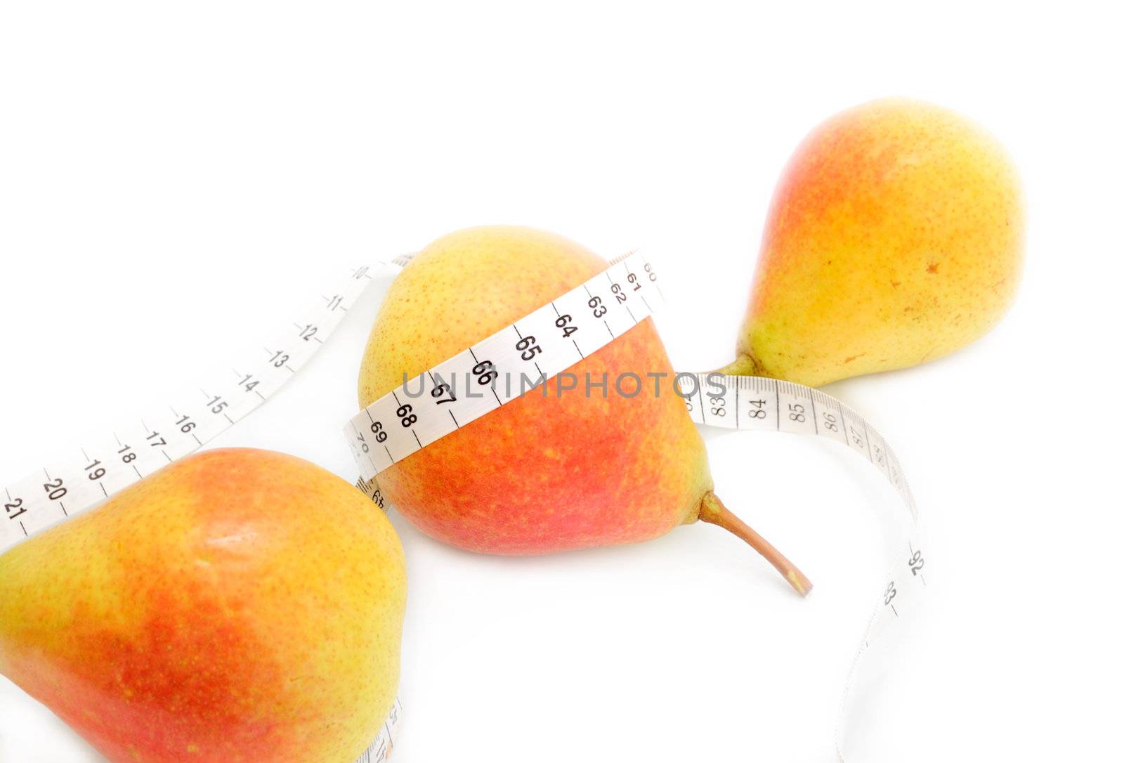 concept of healthy diet - three fresh pears and measuring tape