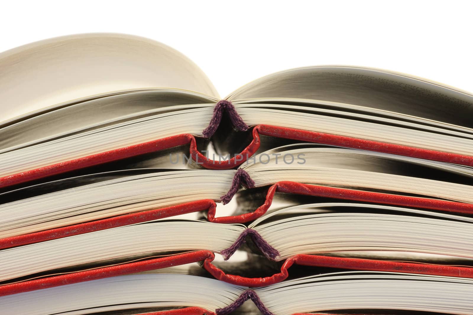 Stack of open books isolated in white