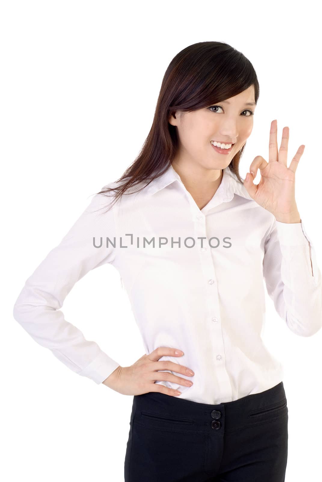 Ok gesture by business woman of Asian on white background.