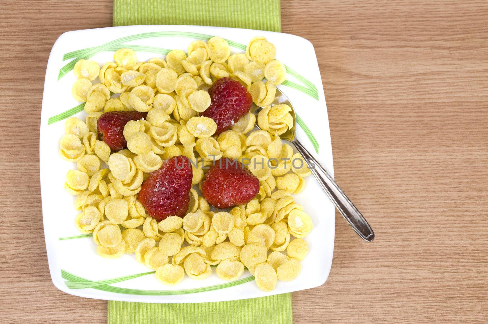 crunchy tasty cereals with fresh organic strawberries