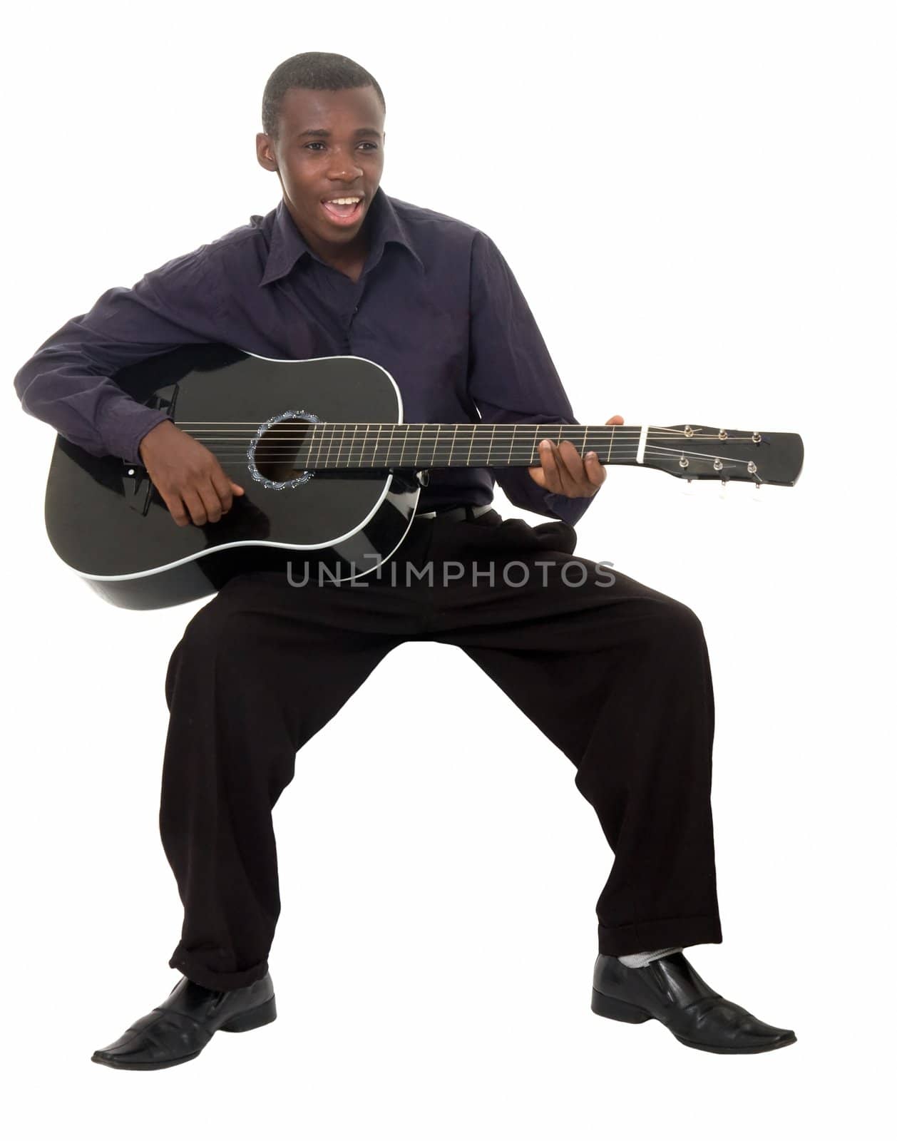 Singing guitarist. The young man with black guitar on a white background.