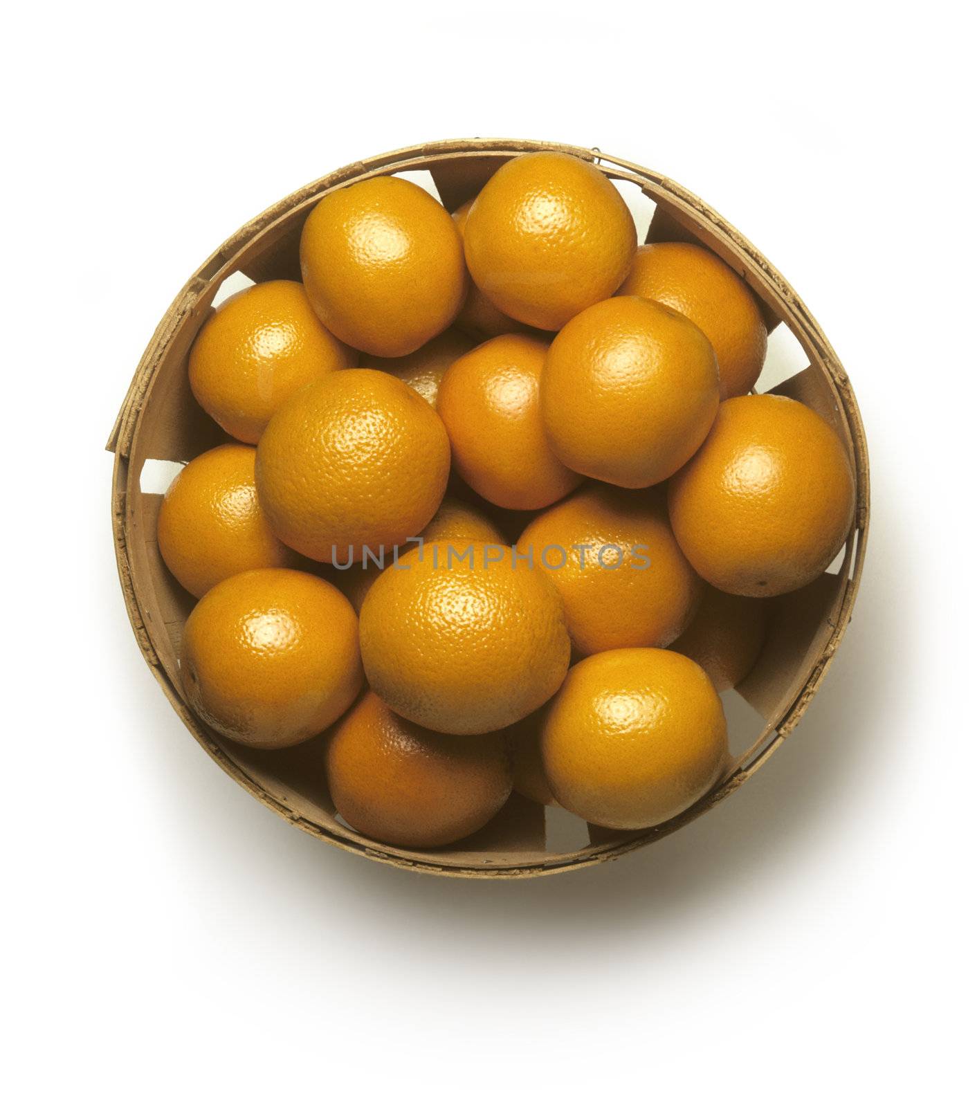 Bushel basket of fresh California oranges on a white background