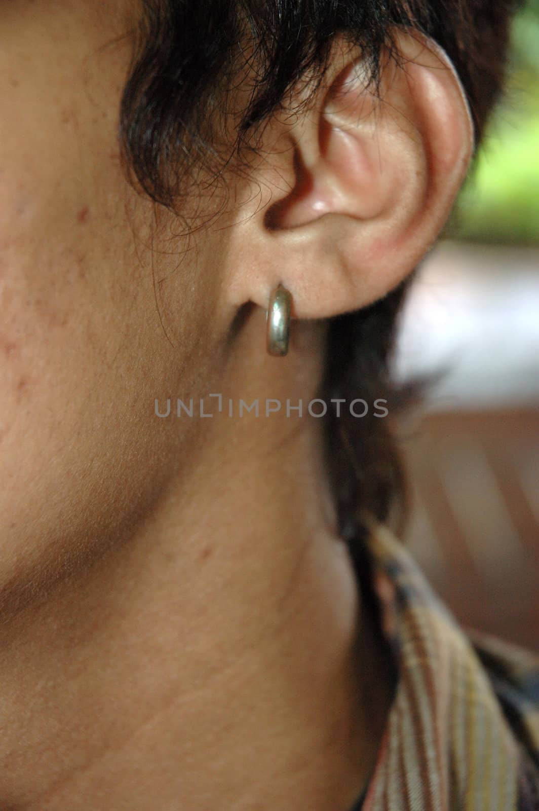 man put on earing on his left ear