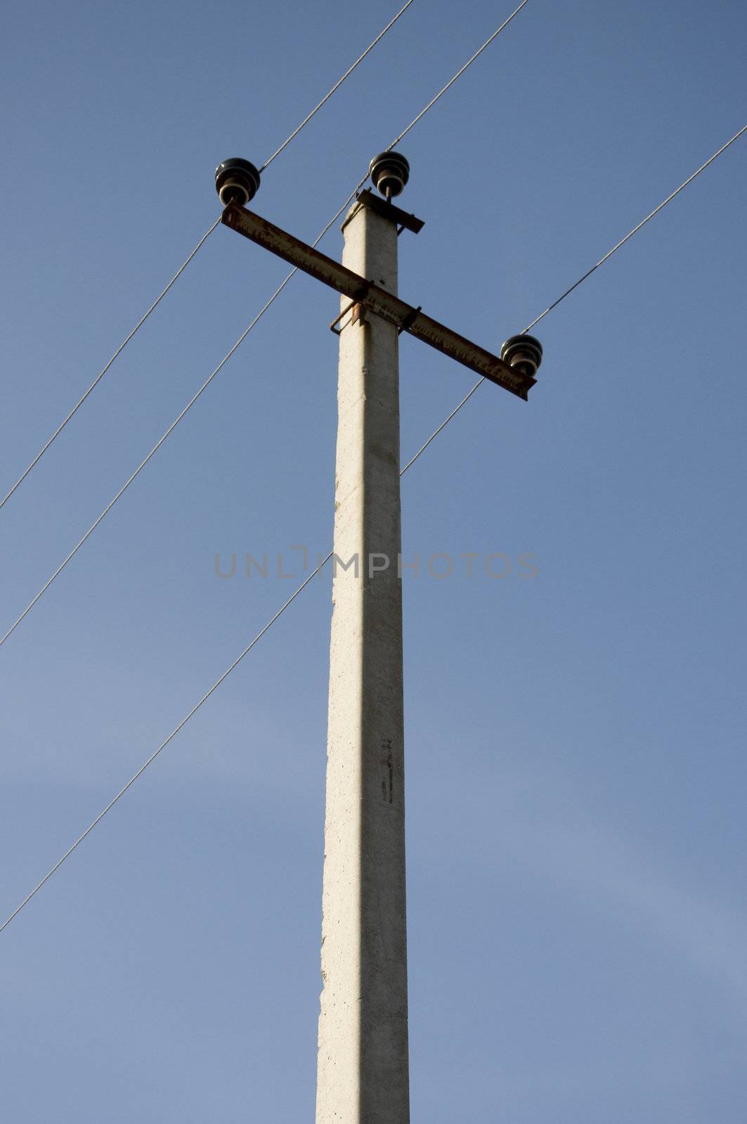 Electric power lines on a blue sky background Electrical tower on a background of the blue sky