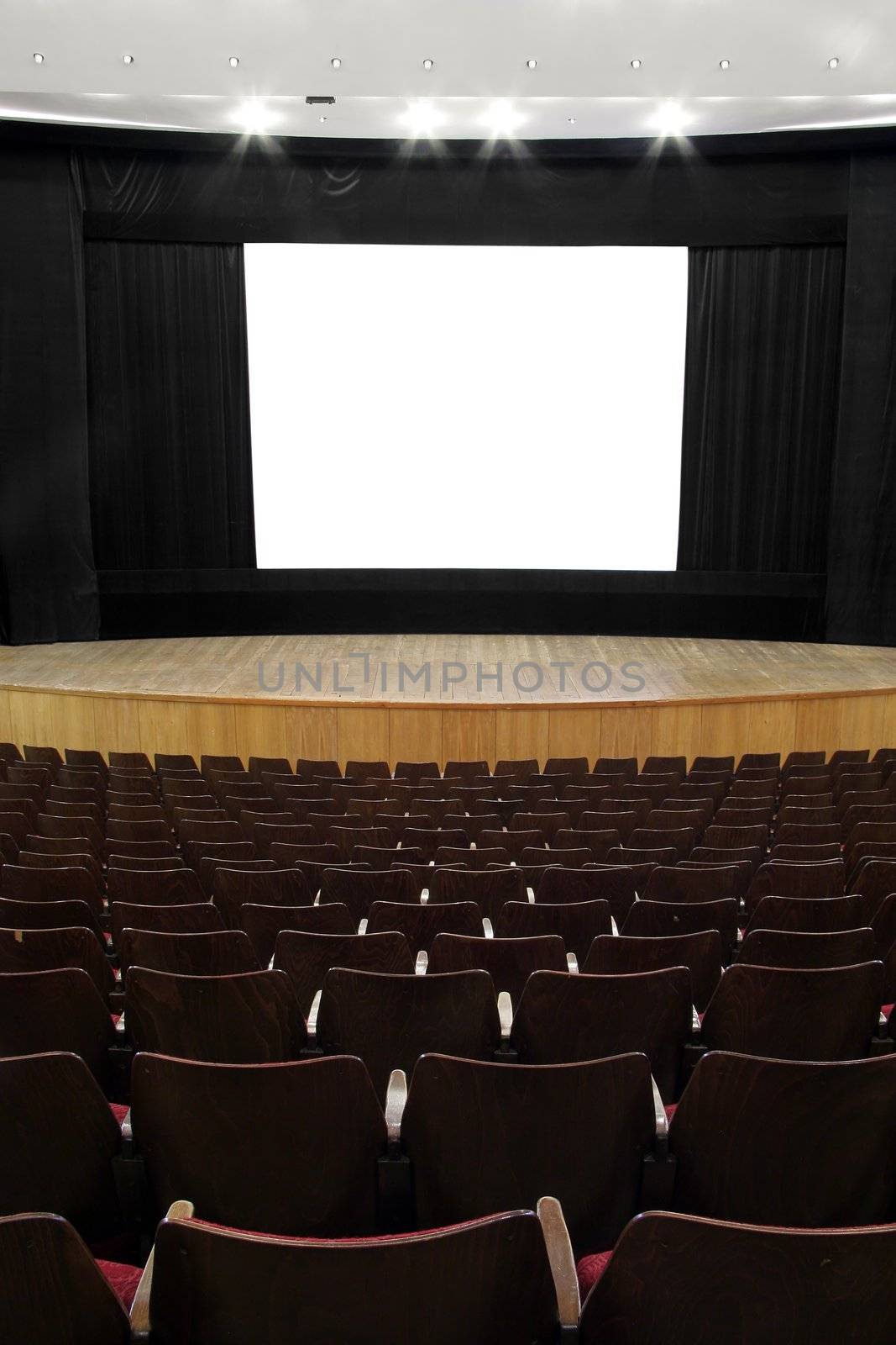 cinema, wooden seats and stage, black screen mask, white empty screen  (1:1,37)