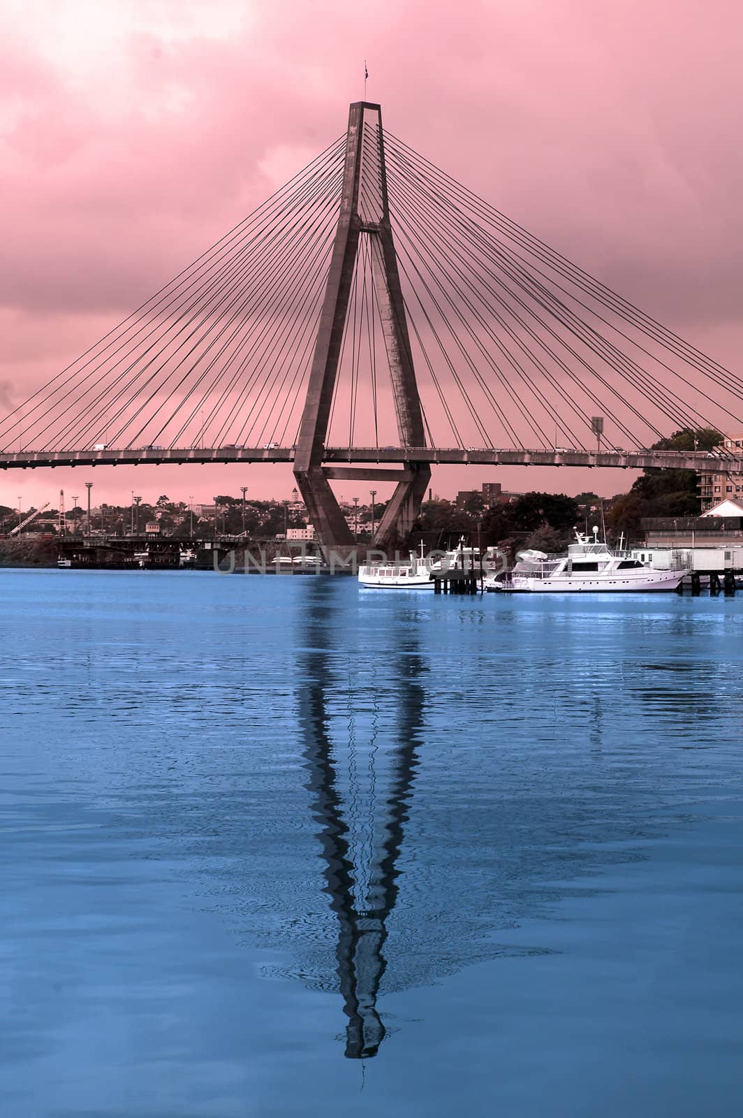 colored picture of Anzac Bridge in Sydney, blue reflection in water, red sky