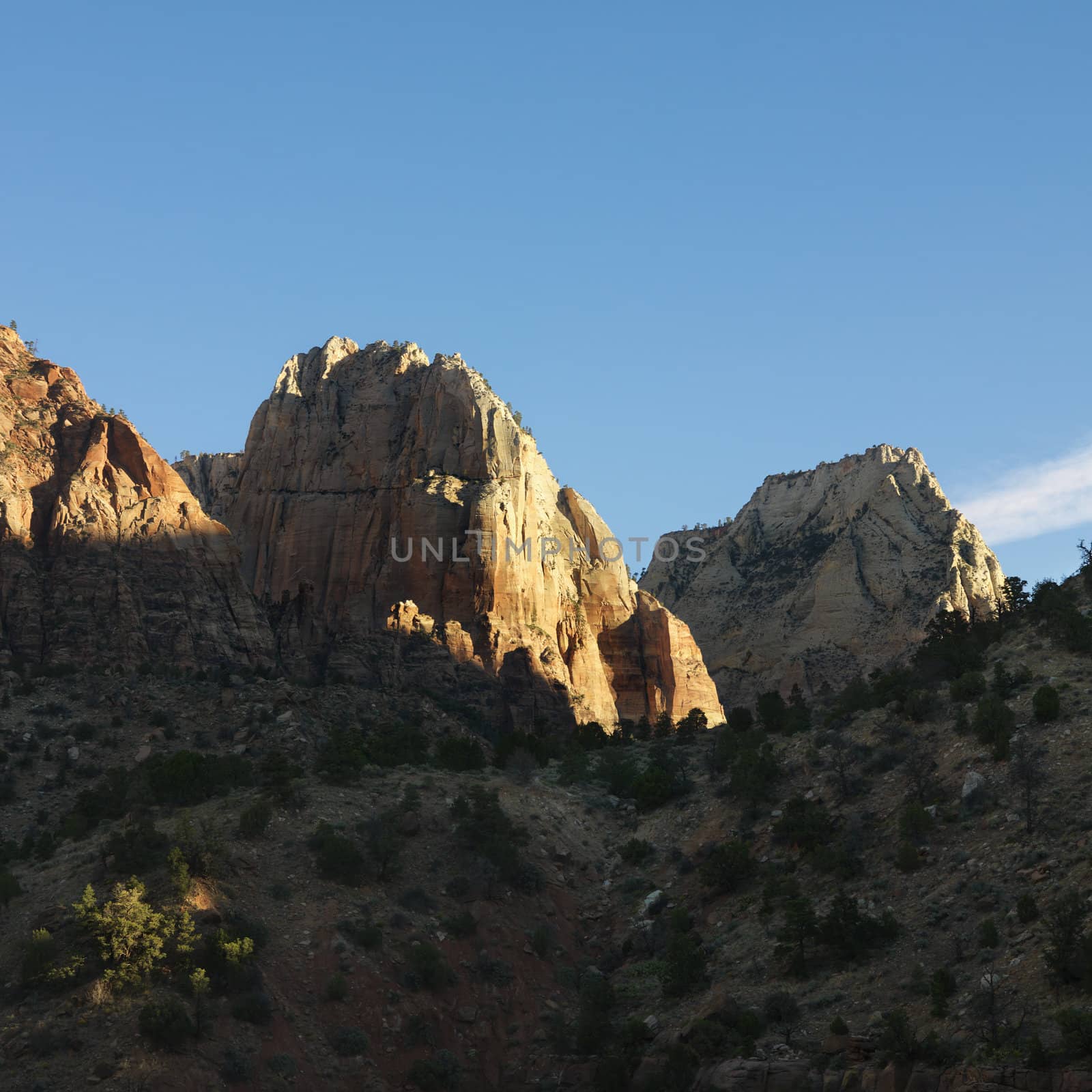 Rocky cliffs and rock formations in desert of Zion National Park, Utah.