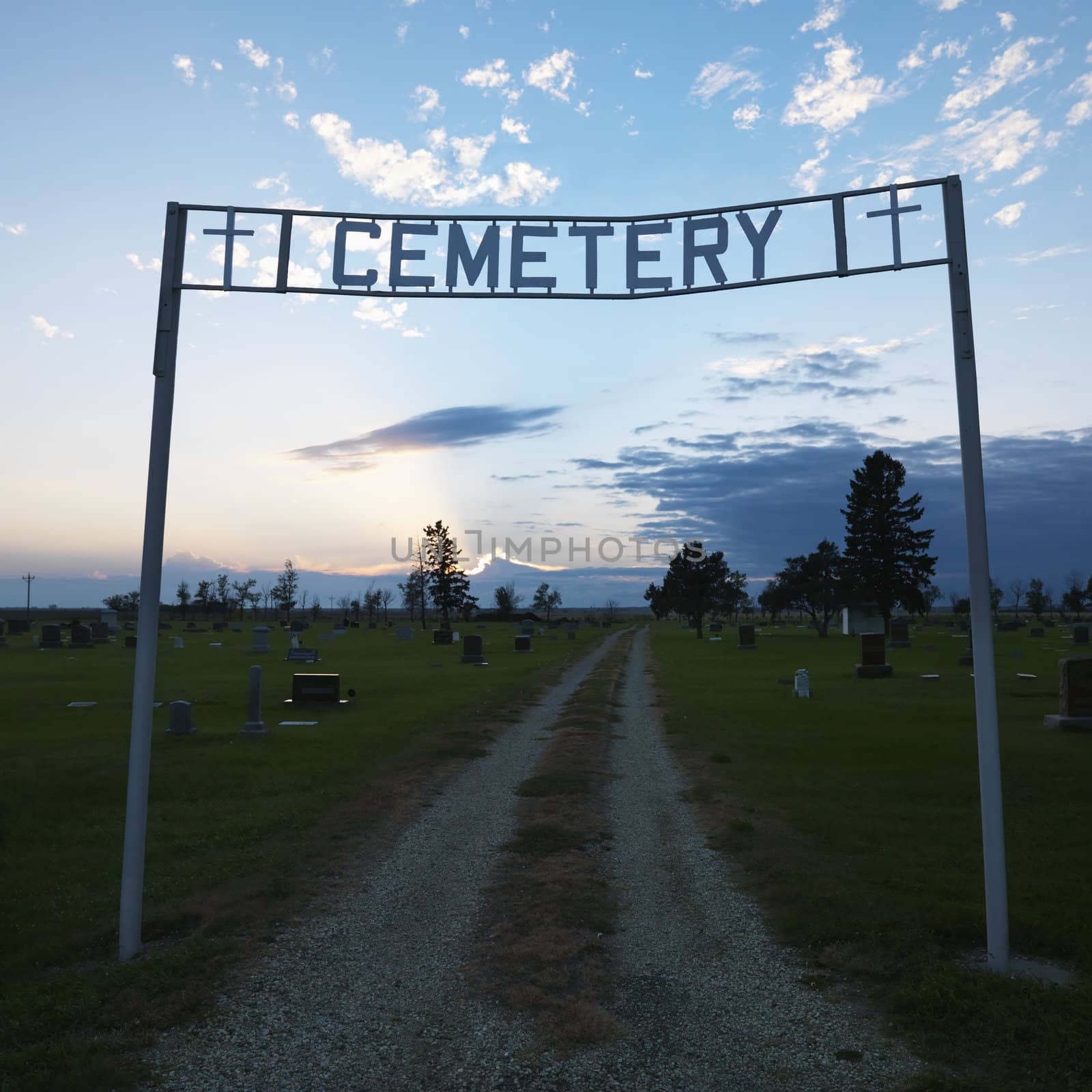 Sign over entrance to cemetary at dusk in rural South Dakota.