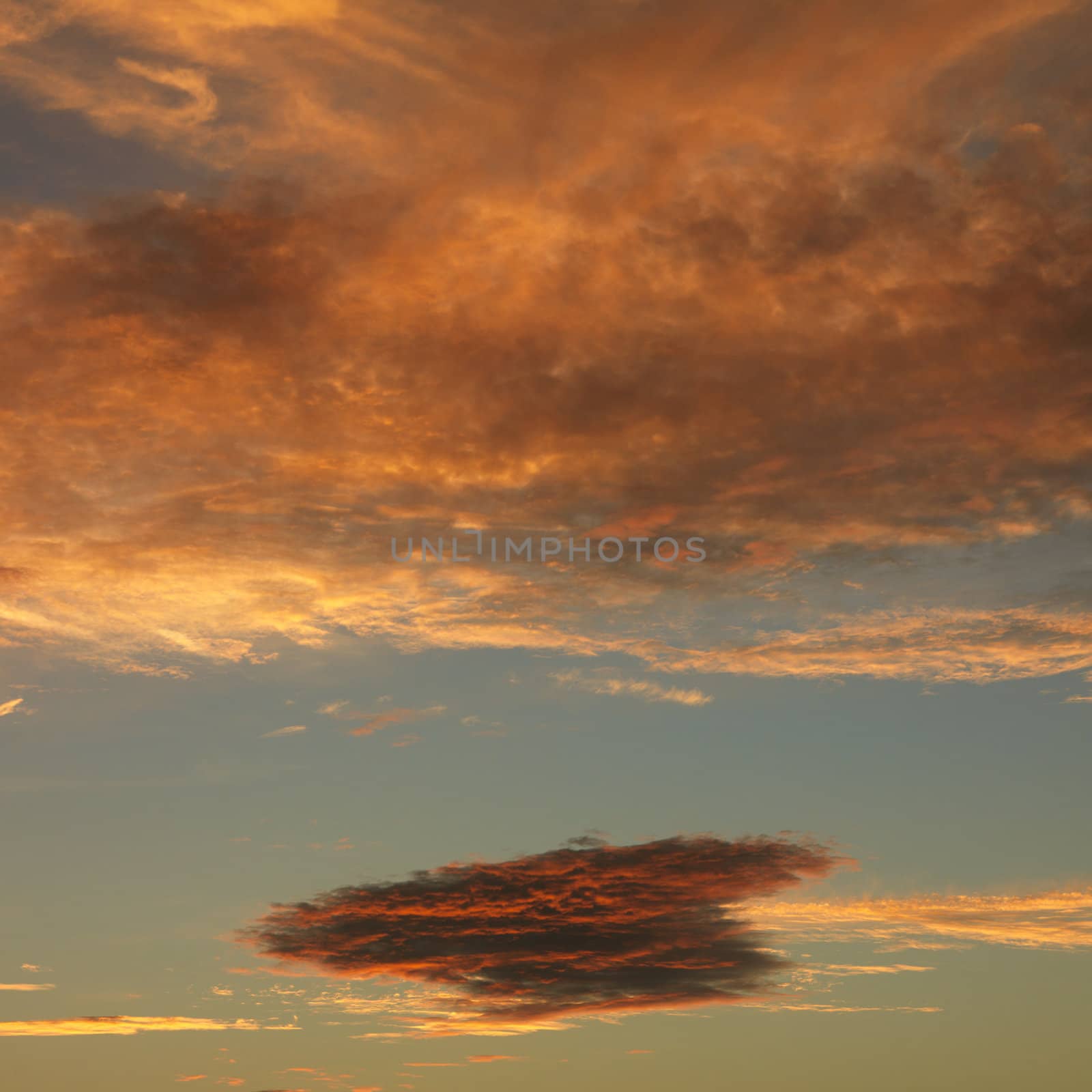 Orange clouds in sky with sunset.