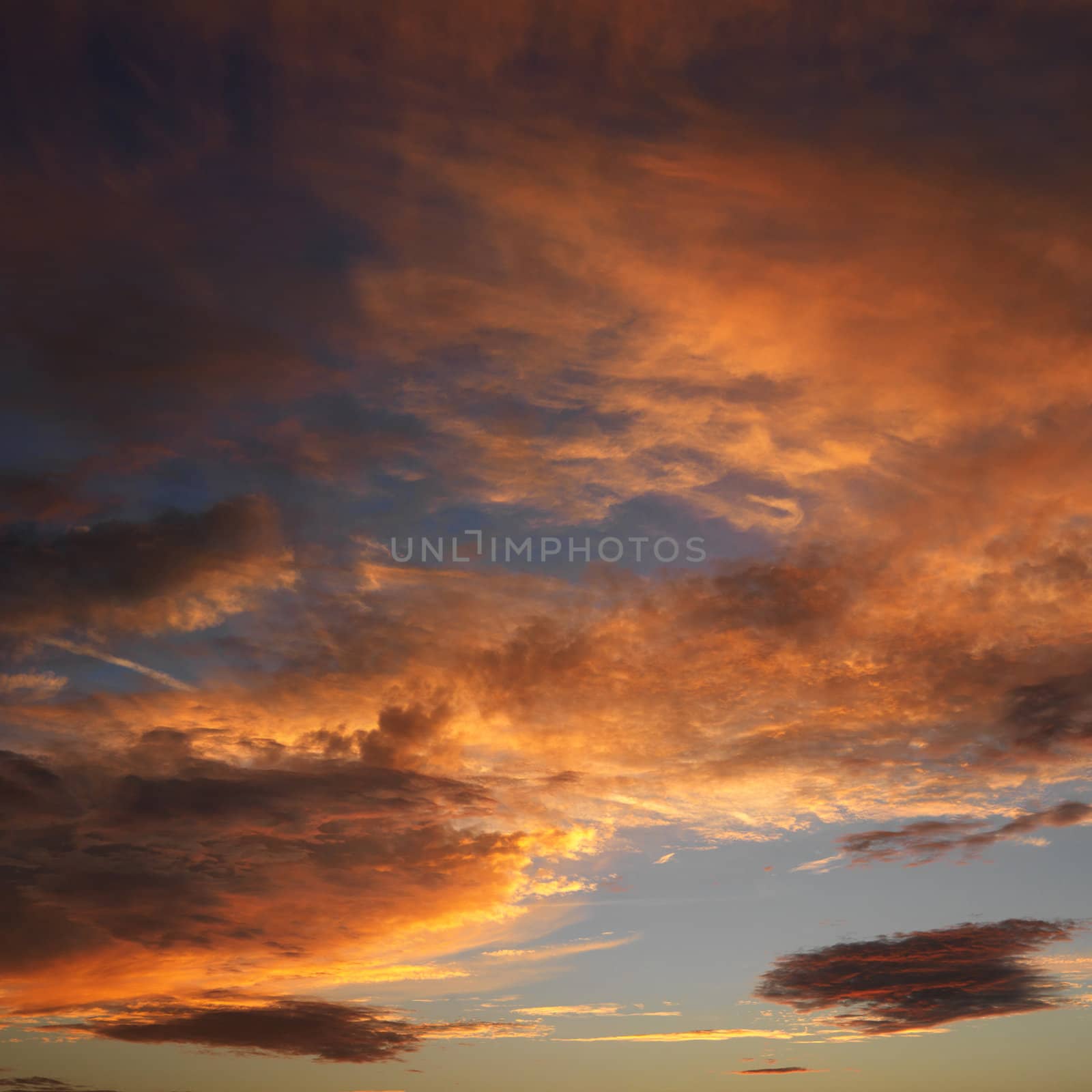 Orange clouds in sky with sunset.