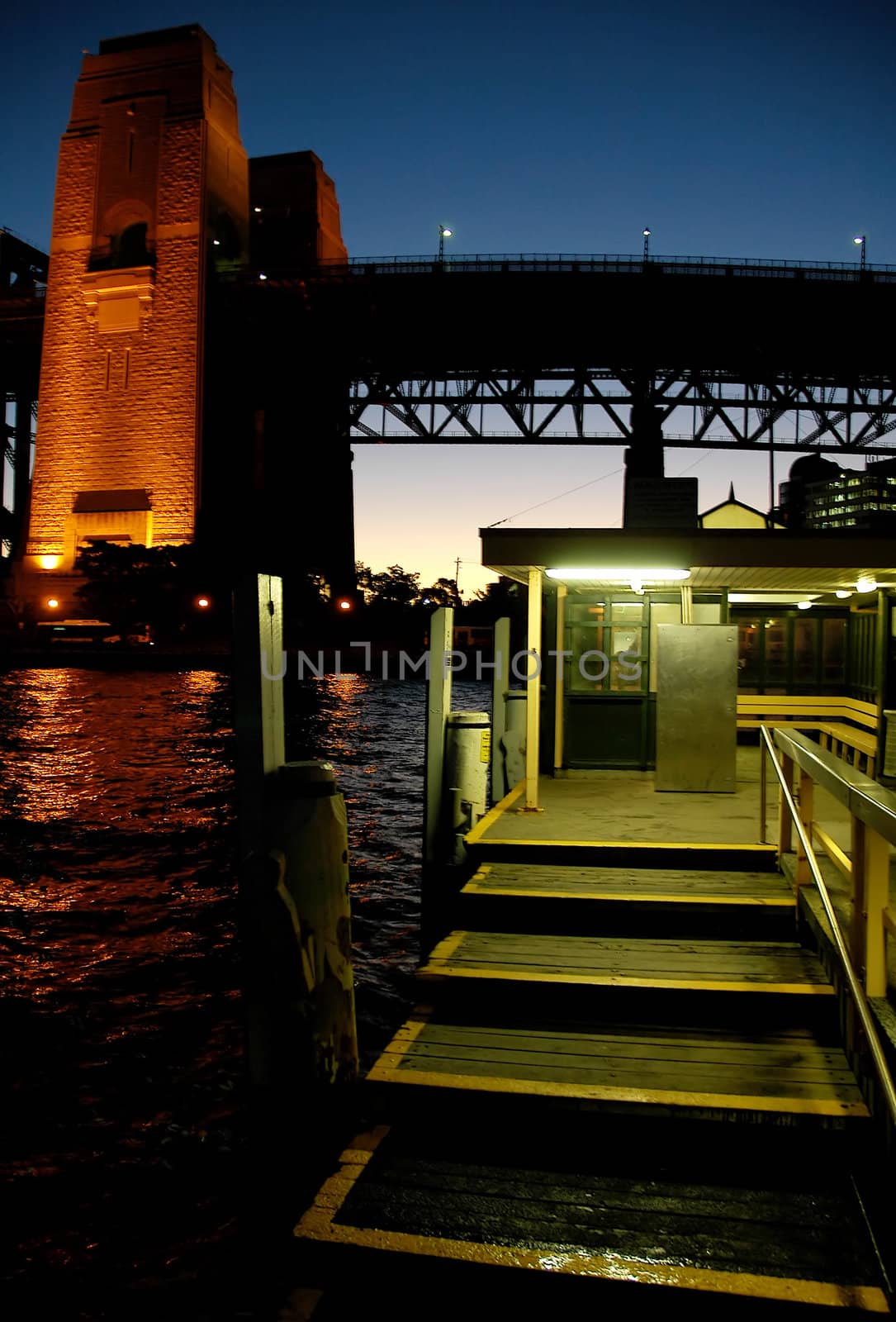 wooden wharf and harbour bridge pillar, night shot