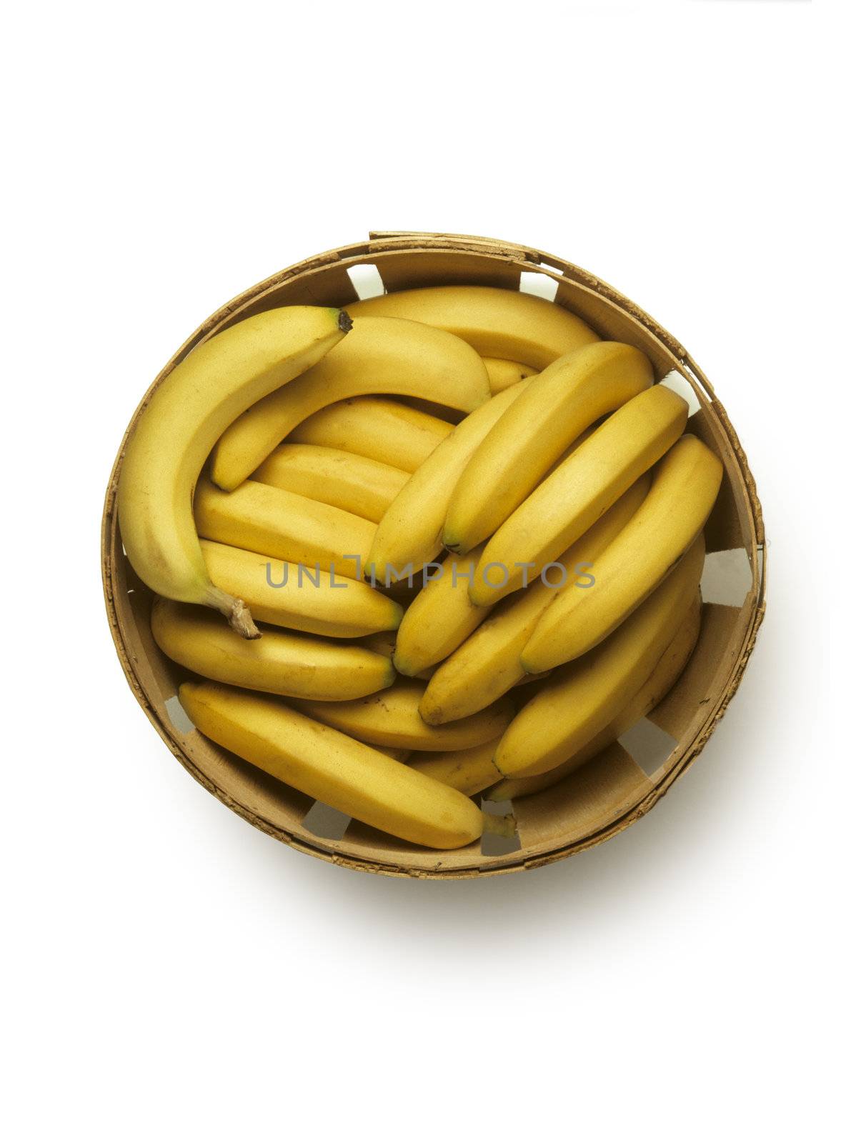Overhead view of bushel basket of yellow bananas