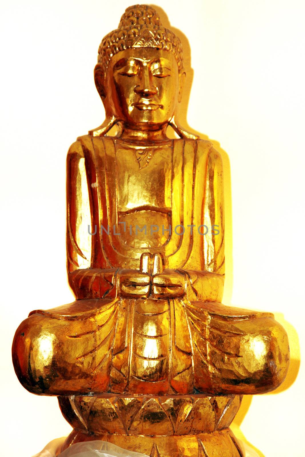 Golden Buddha - figure on a white background