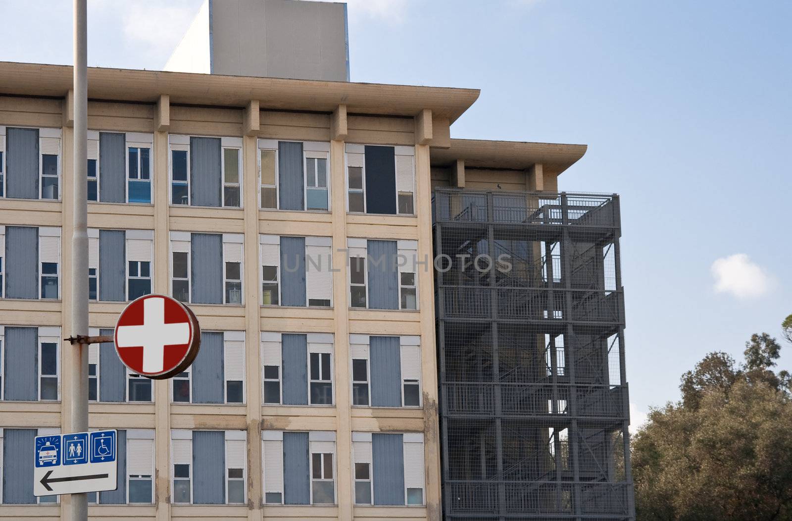 exterior of a modern hospital complex under a blue sky