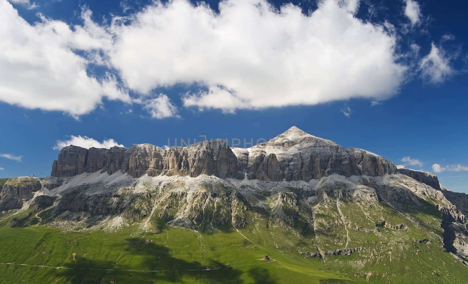 summer landscape of Sella mountain and Piz Boe above Pordoi pass, Trentino, Italy