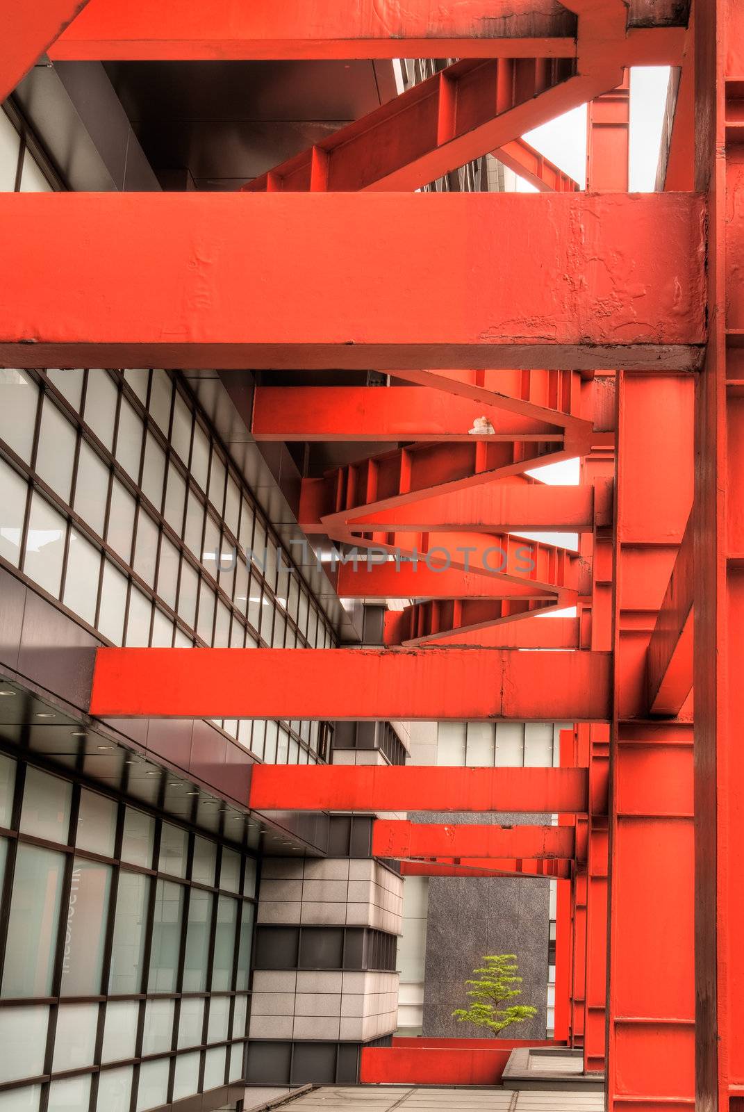 Abstract modern building structure with red column.