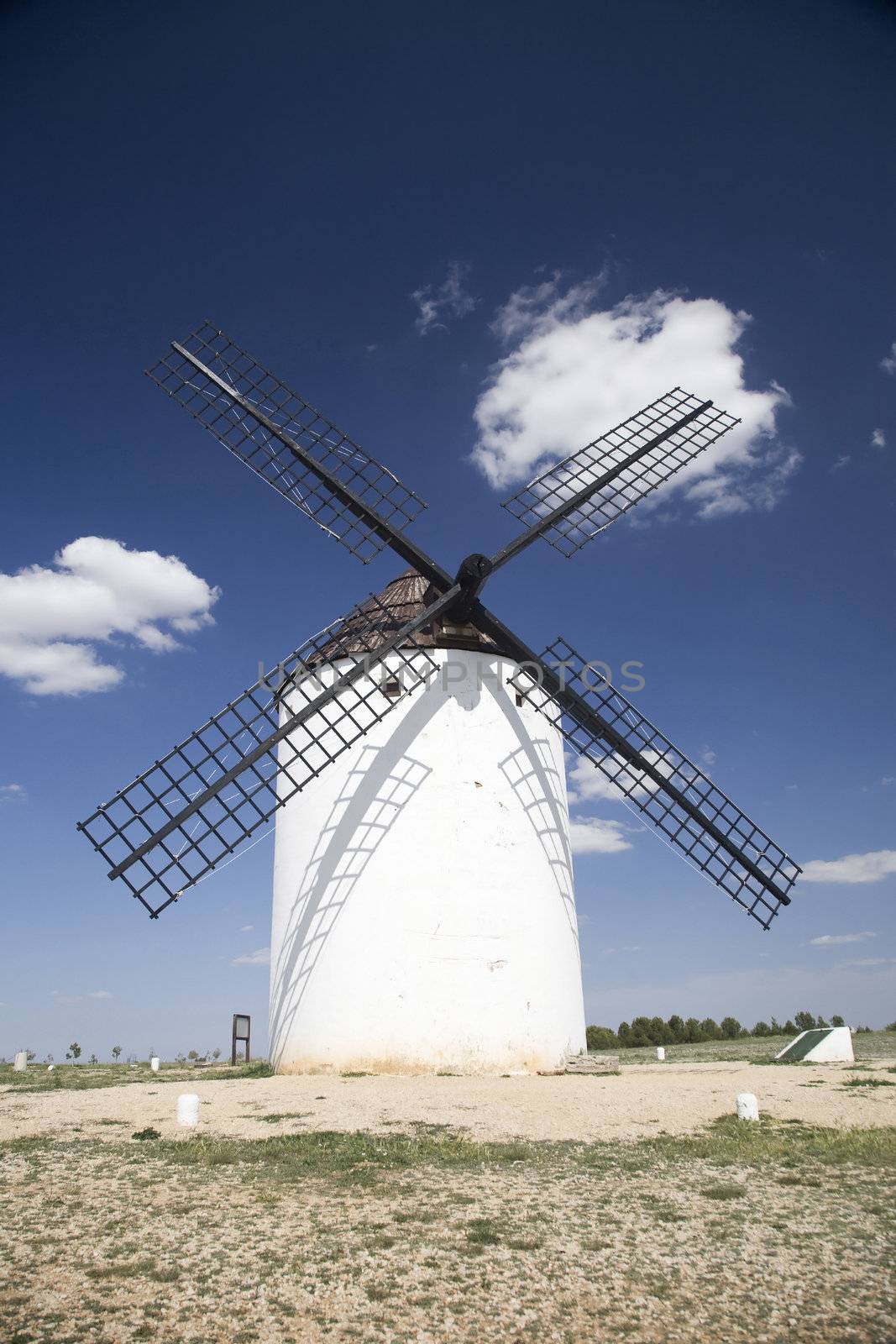 spanish mill with cloud by quintanilla