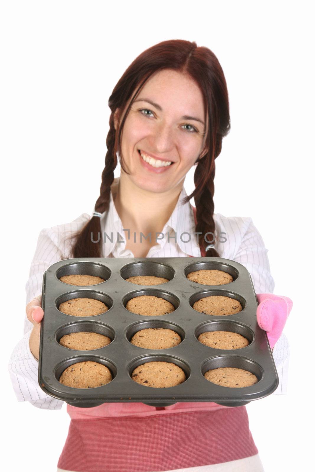 beautiful housewife showing off cakes on white background