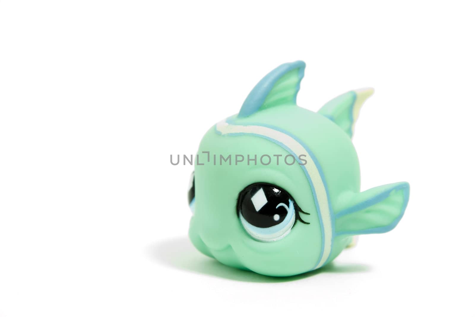 cute toy fish with big eyes, isolated on white