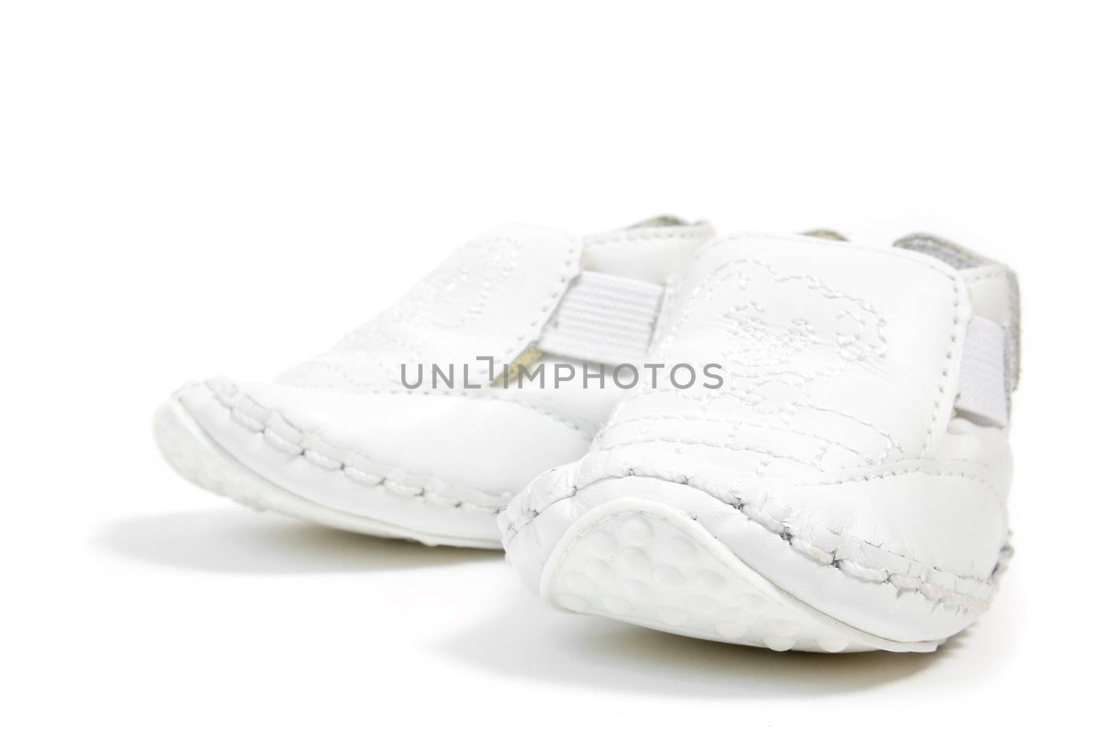 white baby shoes by nubephoto
