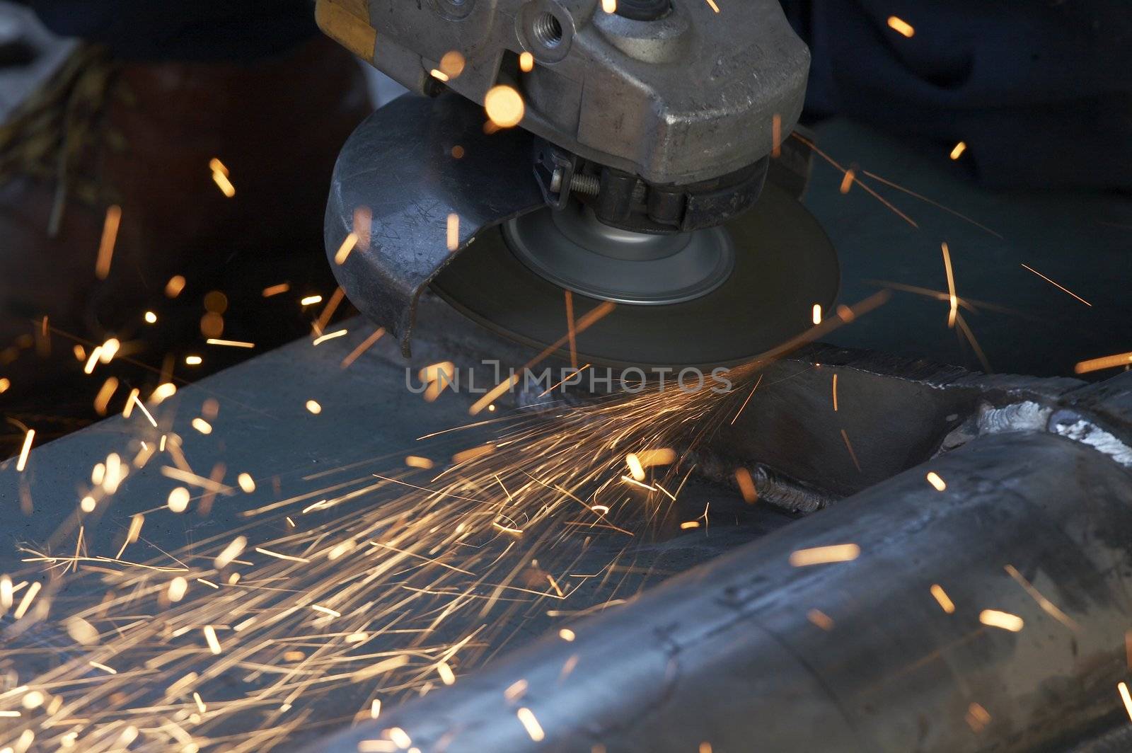 a picture of metal sparks coming from a grinder