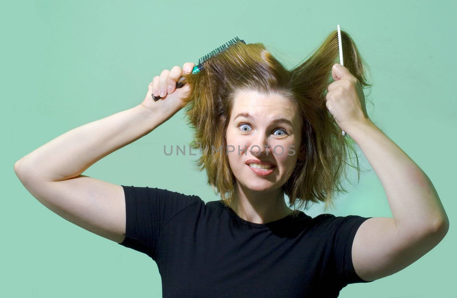 Young woman with combs. Humor's face.