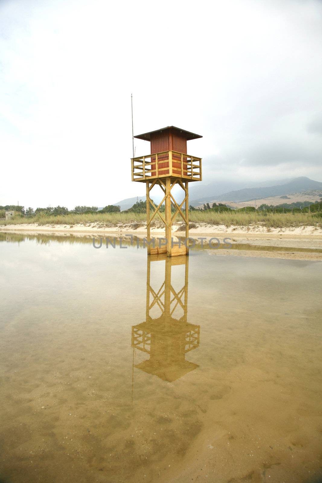 beachguard tower next to the ocean in a tarifa's beach