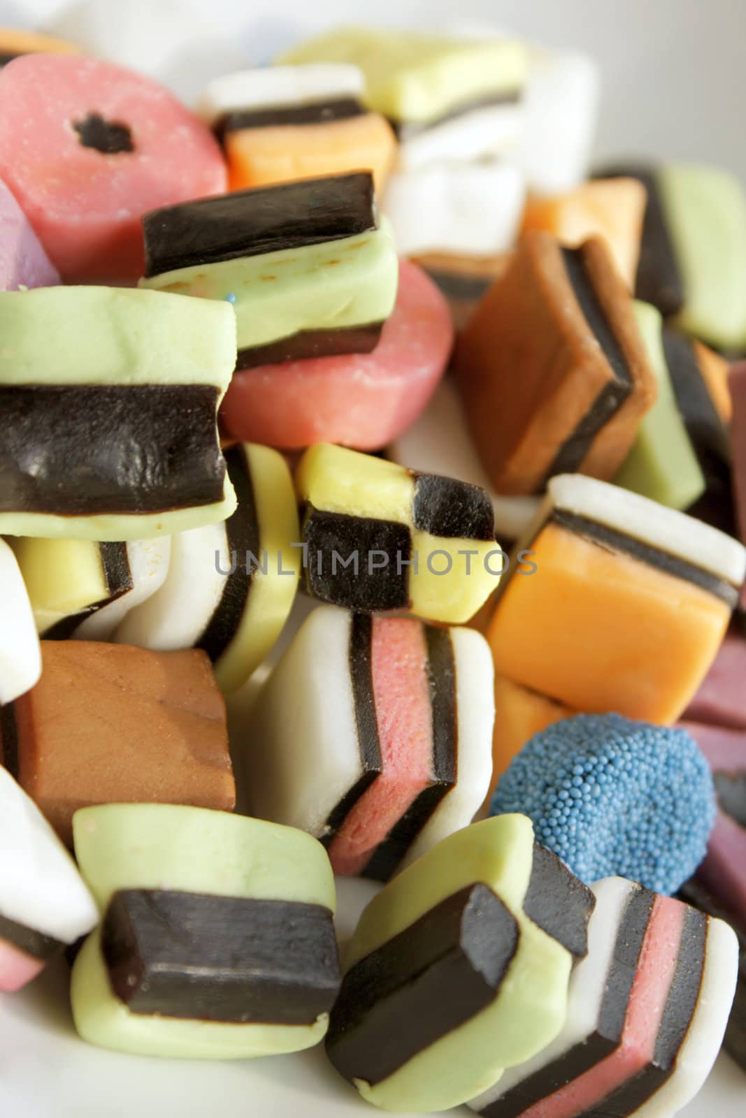 Close-up of some colored allsorts liquorice candies
