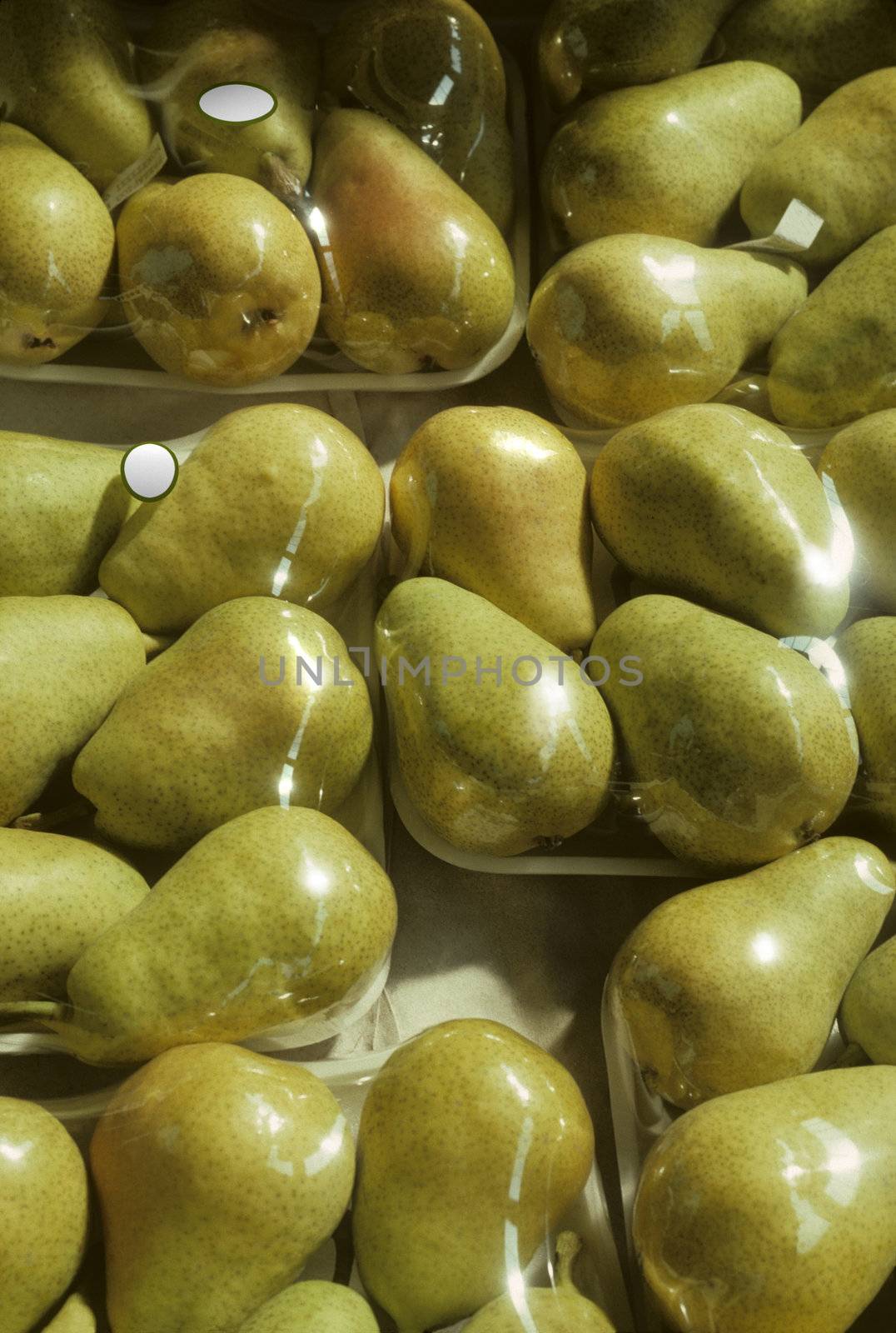 Styrofoam shrink-wrapped trays of Bartlet pears ready to go to market