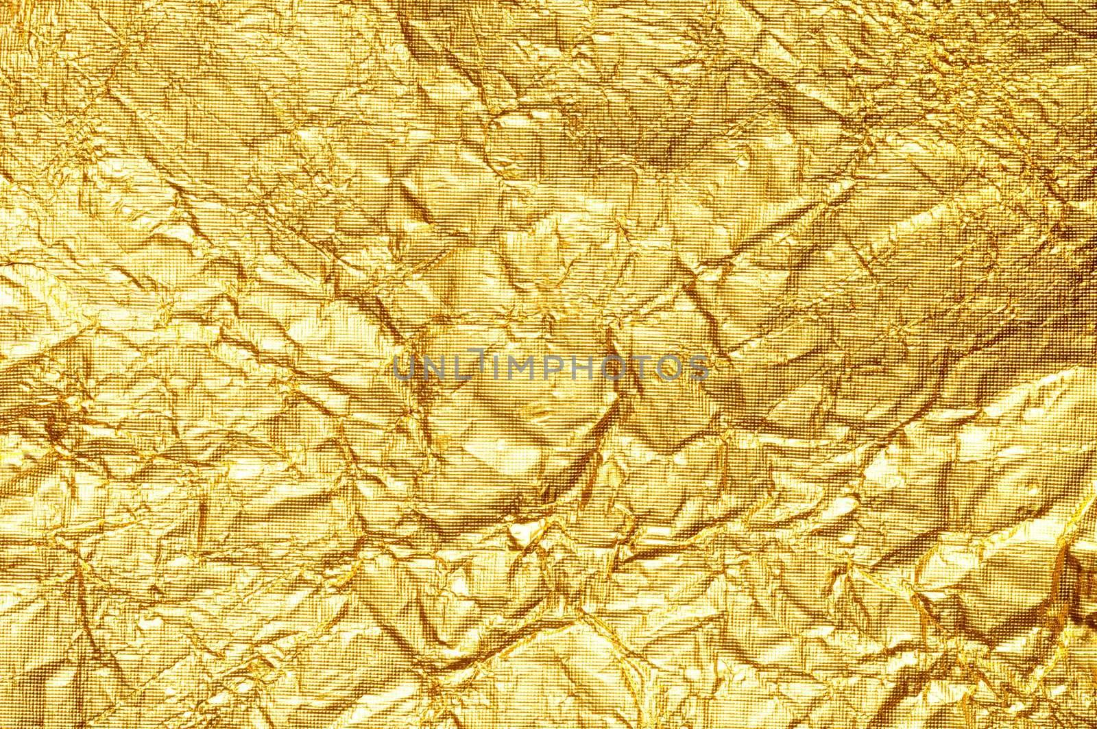 Crumpled gold foil textured background Horizontal