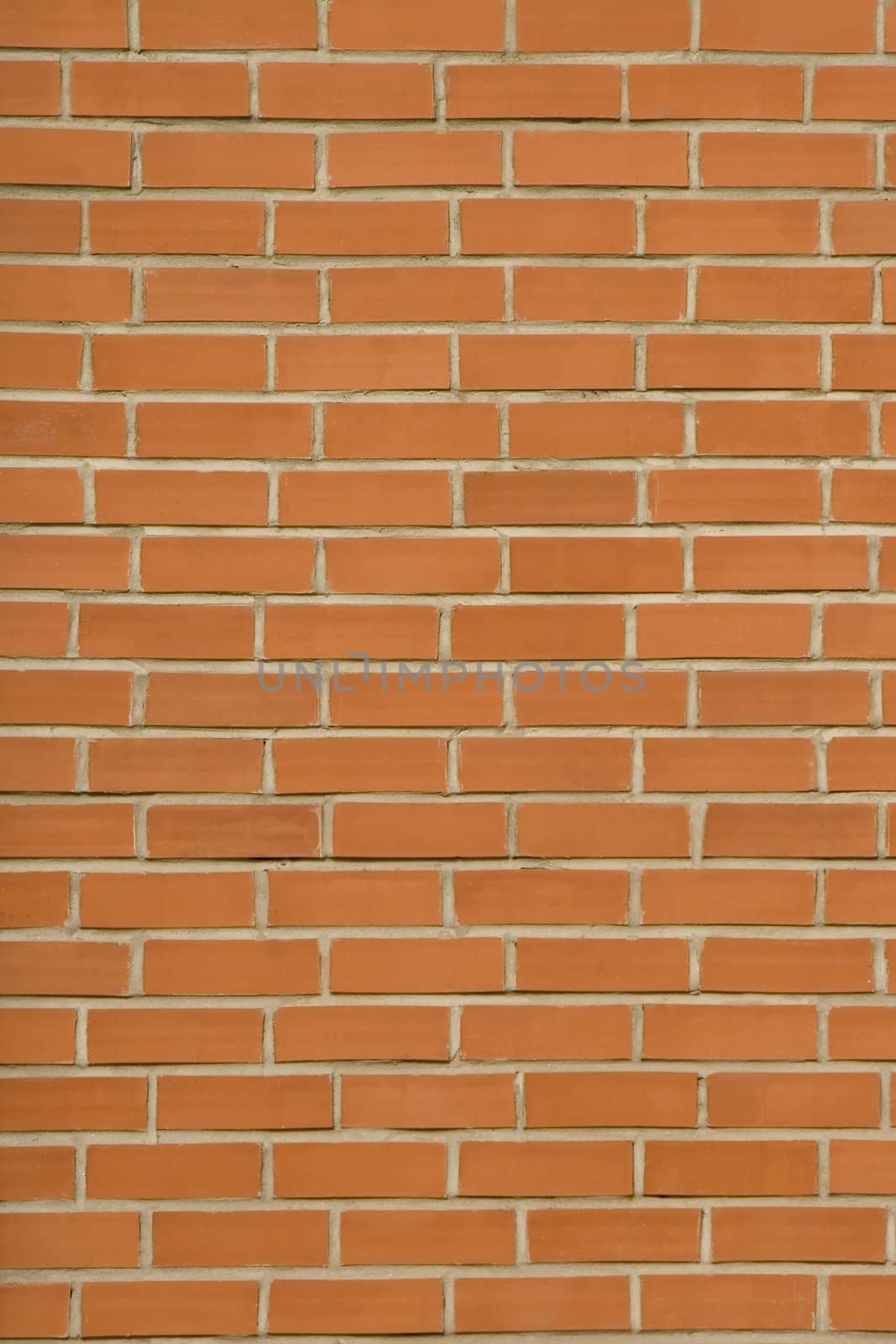 front view of red bricks wall with concrete