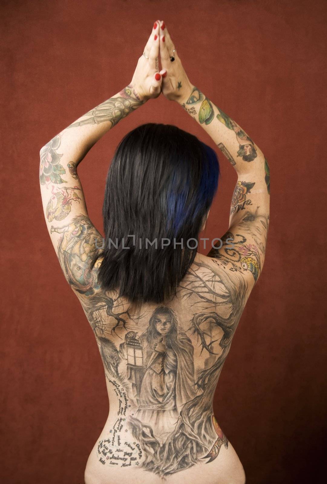 Pretty young woman with many tattoos